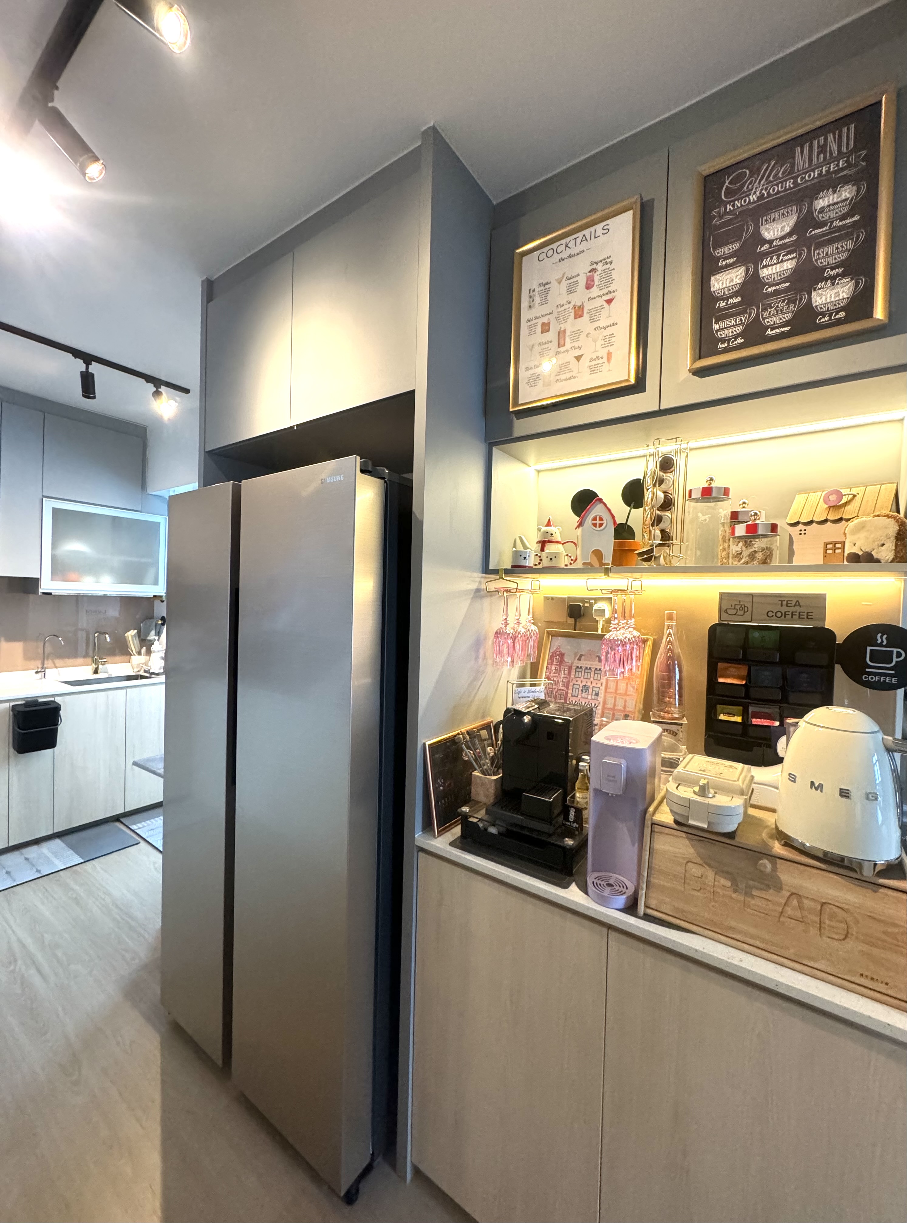 3 Fridge Organisation & Optimisation Hacks - Modern kitchen with sleek stainless steel refrigerator, under-cabinet lighting