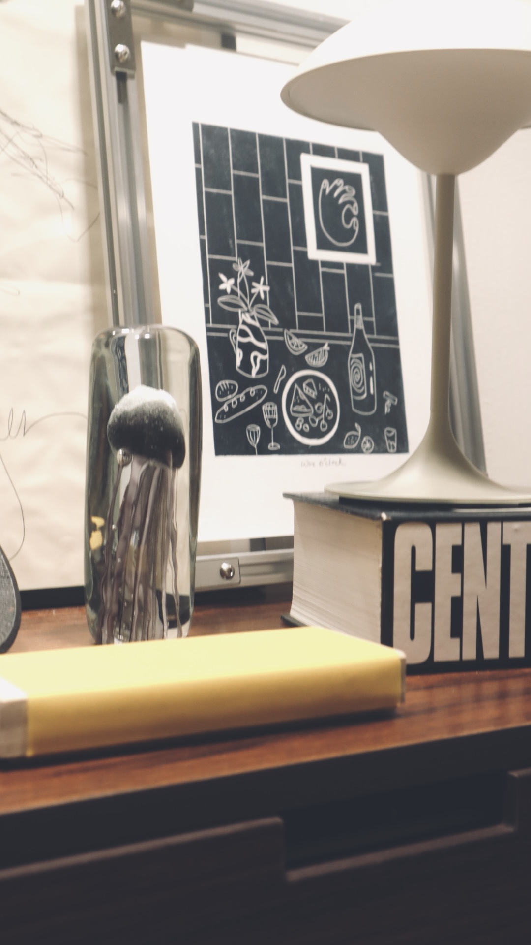 (chair, book, light) maketh nook : trinity to a cosy corner  - vase, lamp, books, yellow book, black and white illustration