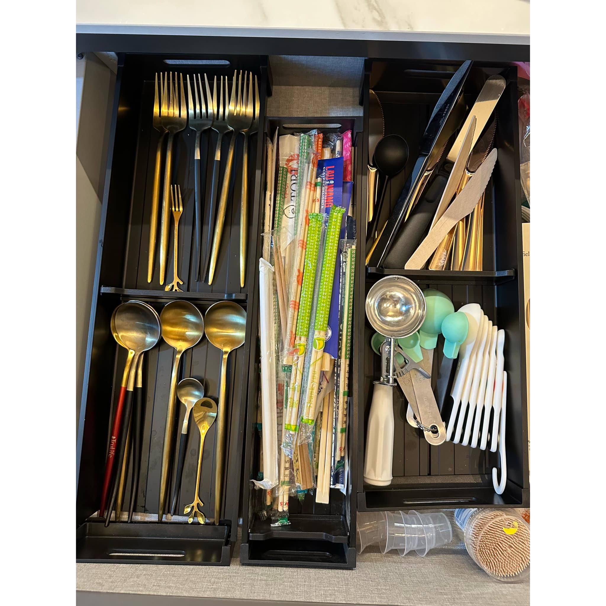 Organisation Lesson 101: 7 Tips To Getting Organised(Kitchen Edition)  - Gold utensils, black drawer, neatly organized
