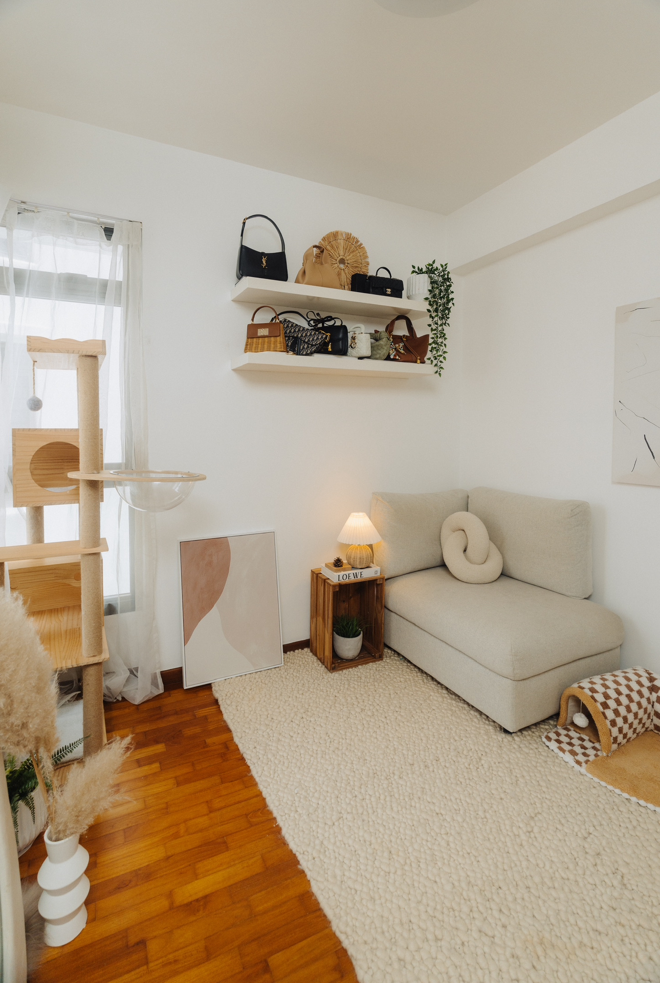 Our Spare Room: Styling It Into A Cosy & Multifunctional Space - Wooden cat tree, beige sofa, abstract painting, fluffy rug