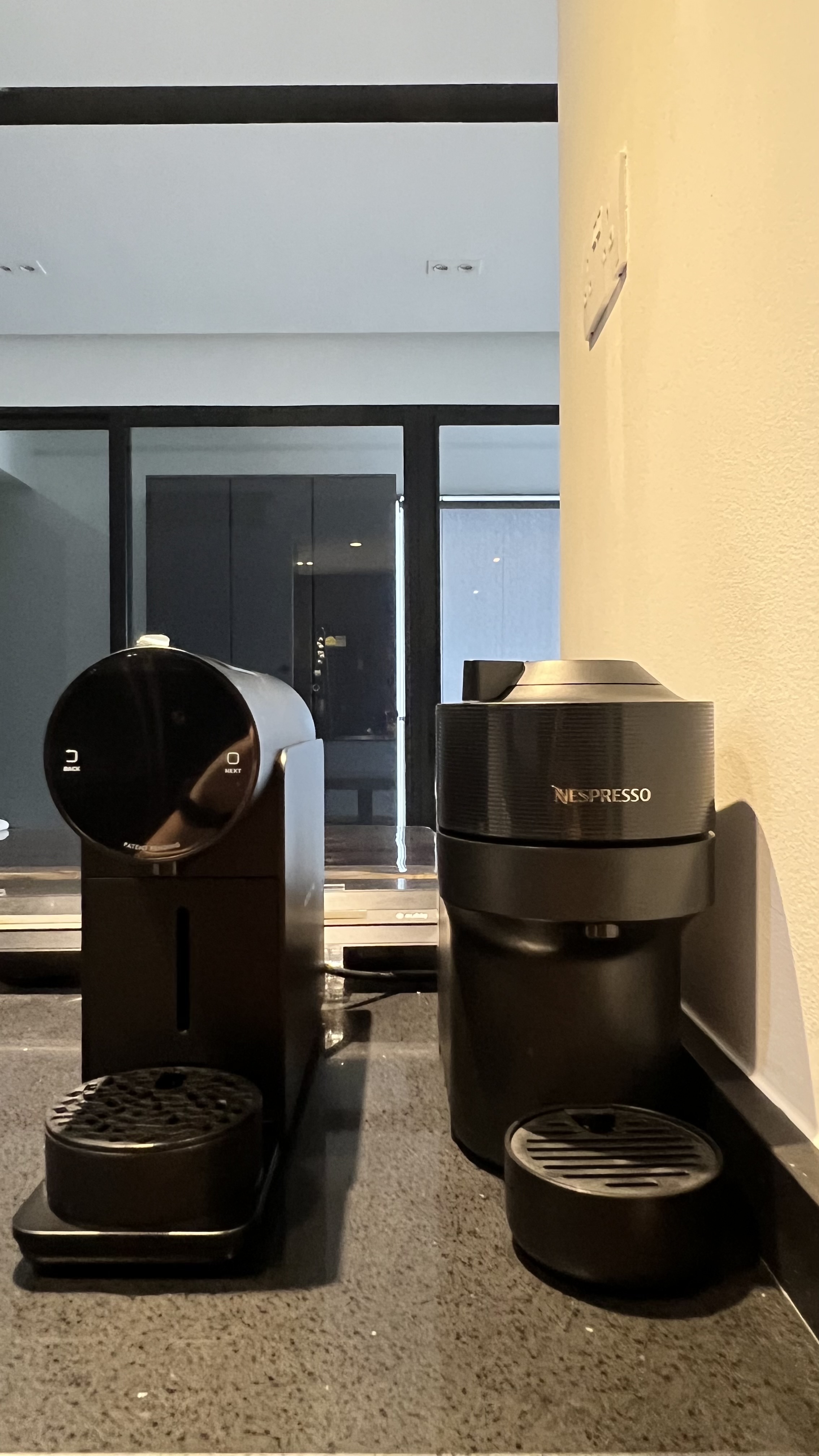 From Clutter to Calm: Transforming with Thoughtful Organization - Modern coffee machines, sleek design, black and silver