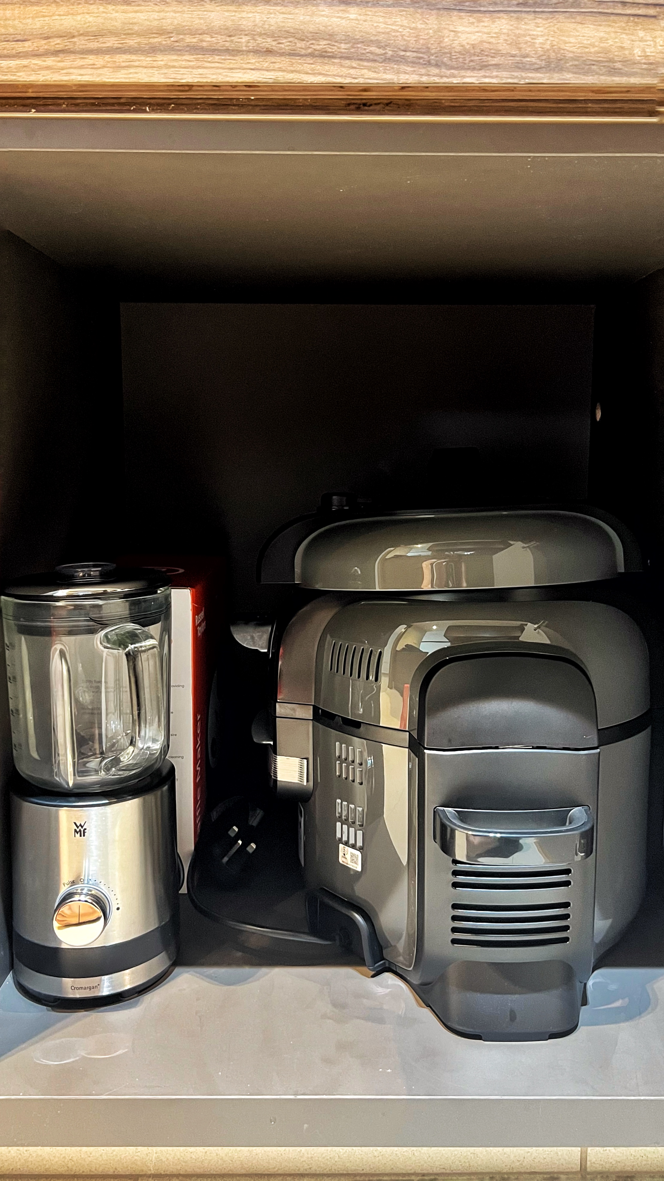 From Clutter to Calm: Transforming with Thoughtful Organization - Clear blender, toaster, and coffee machine on kitchen
