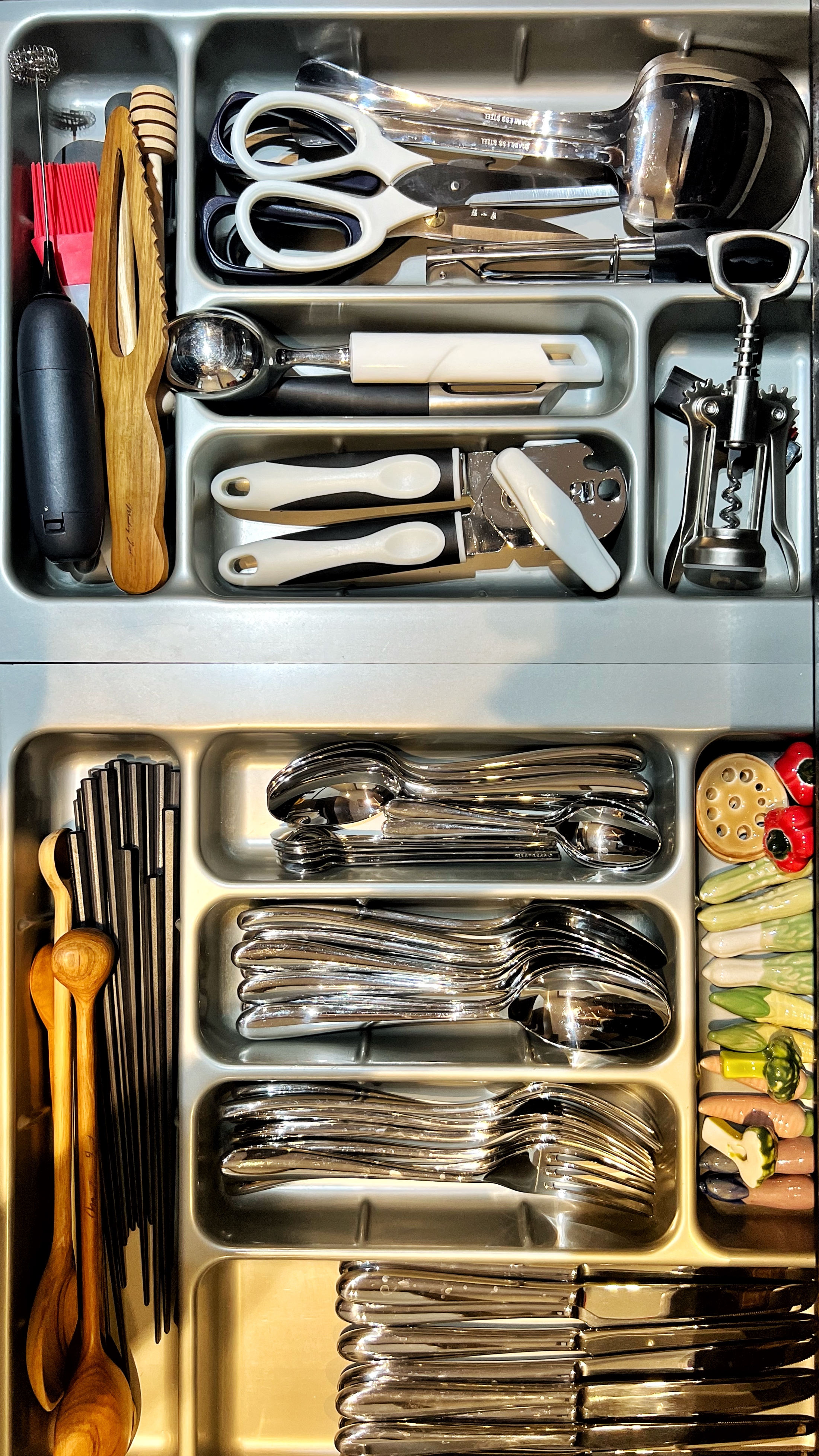 From Clutter to Calm: Transforming with Thoughtful Organization - silverware organizer, stainless steel tray, neatly