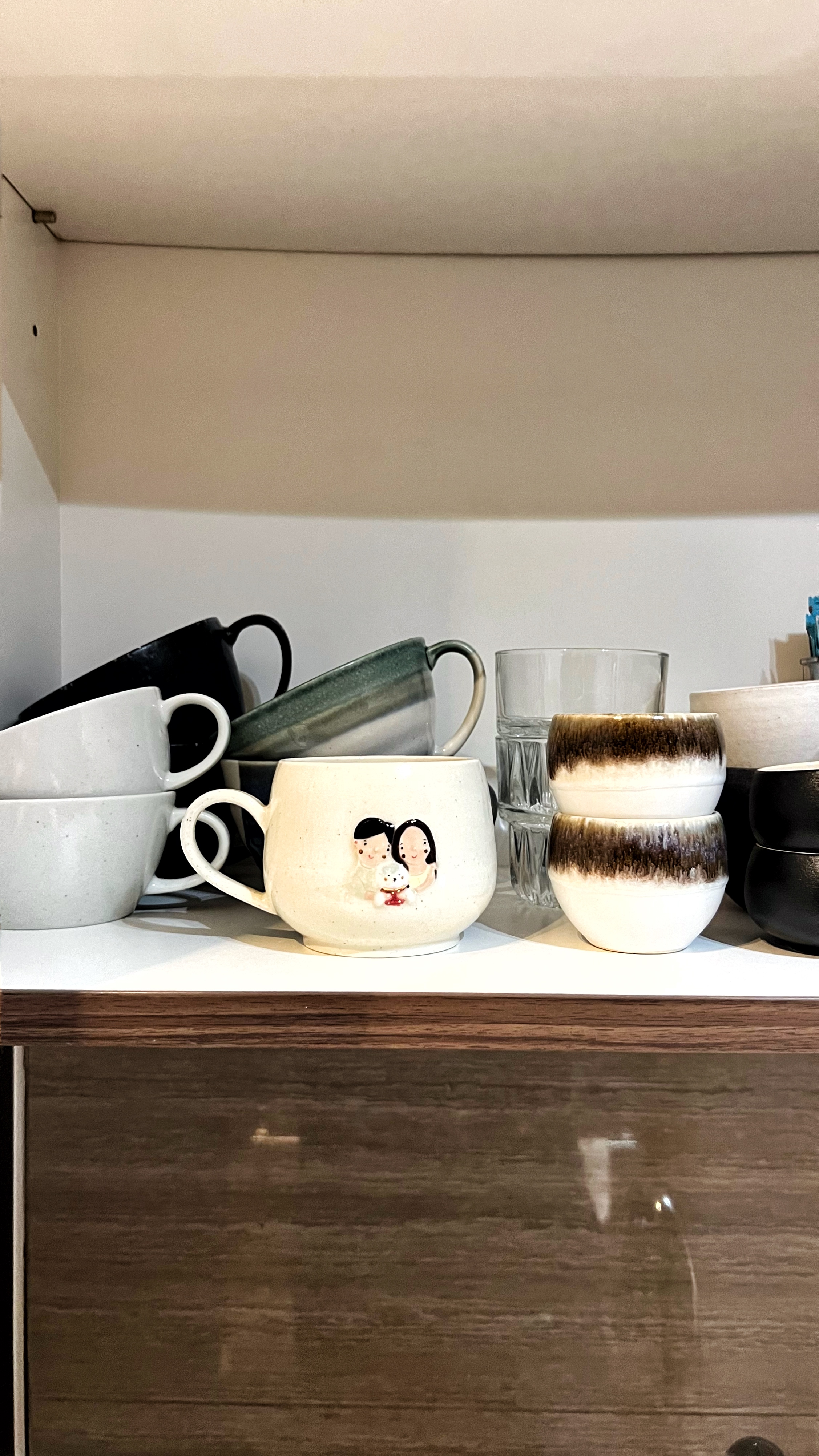 From Clutter to Calm: Transforming with Thoughtful Organization - mug, ceramic, white, black, brown, shelf, kitchenware