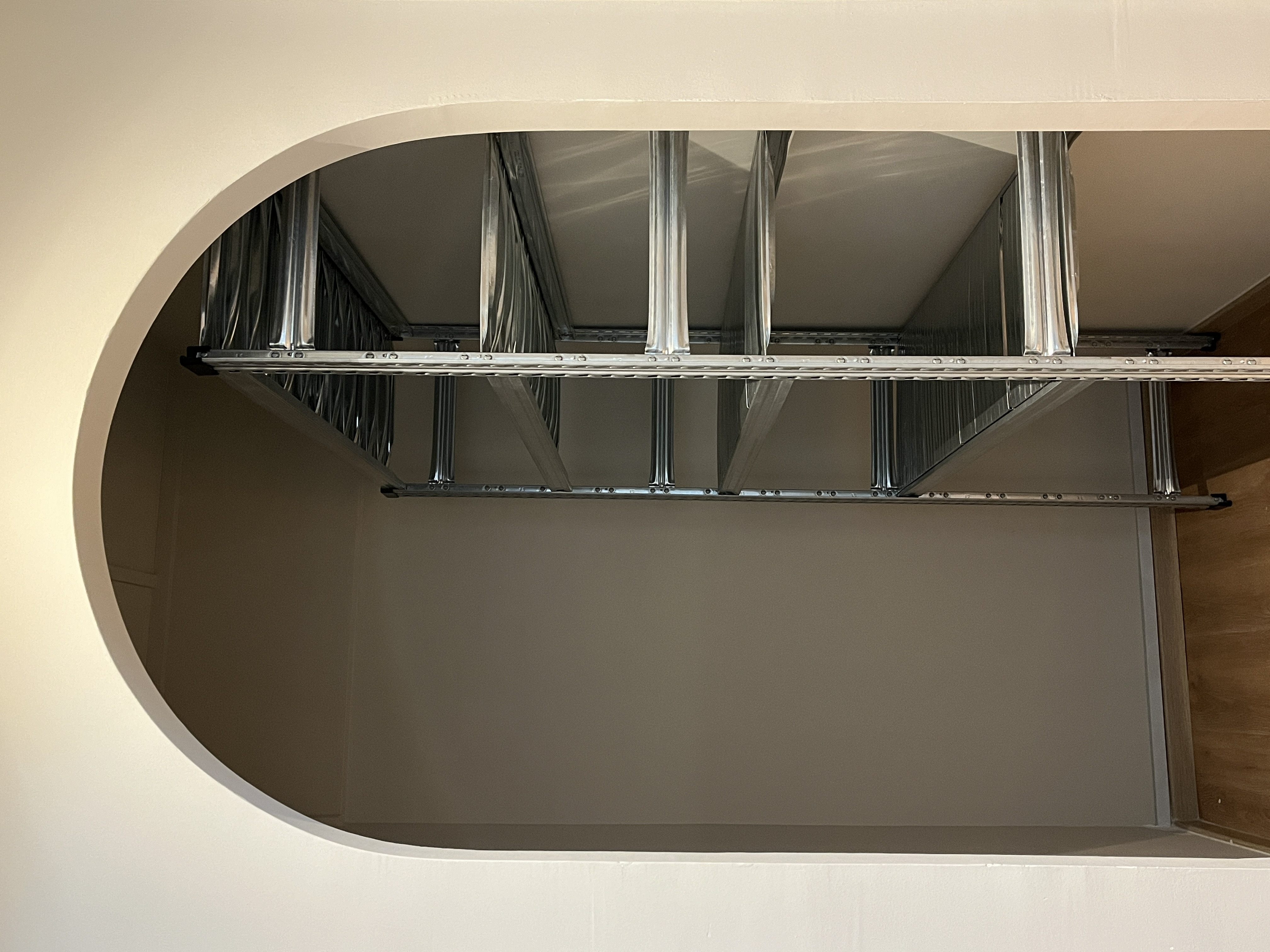 Home Organization We Love - metallic ductwork, industrial shelving, metal framework, ceiling-mounted racks, duct tape
