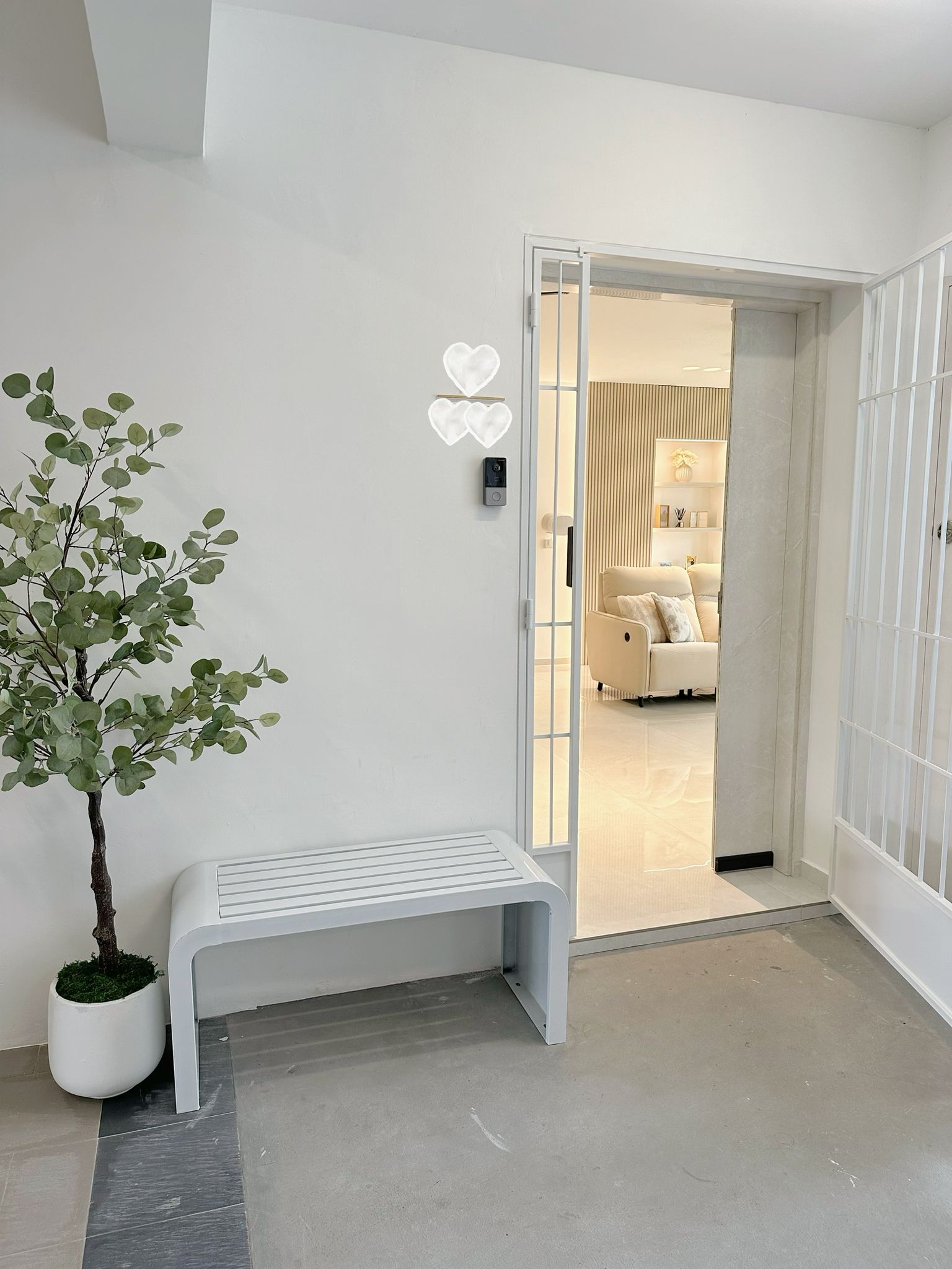 Our entrance: Clean, with a pop of green - White minimalist interior, modern decor, cozy living room, neutral color palette