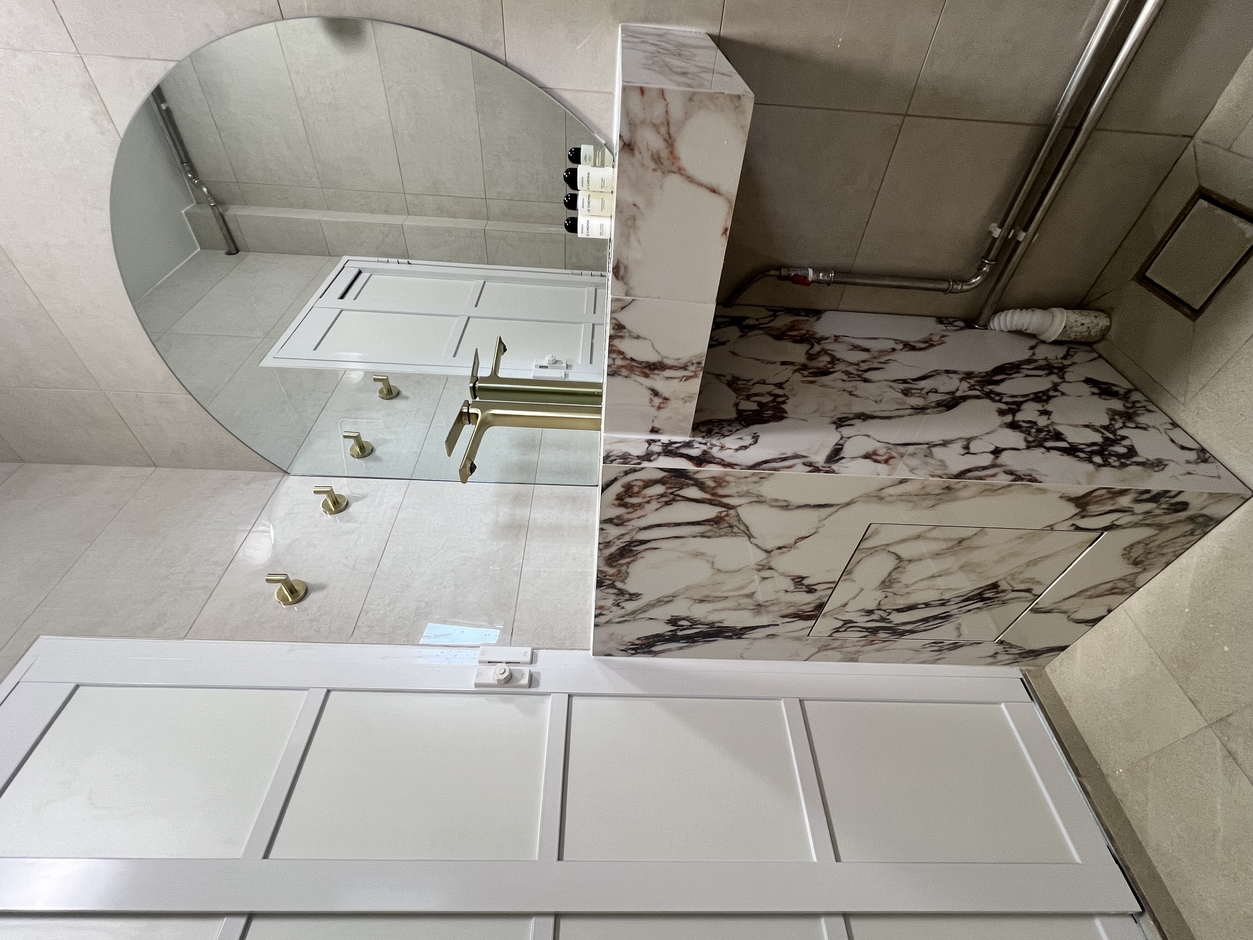 Desert Dreams: A Dune-Inspired Oasis with a Bold Vanity! - Mirror, bathroom, vanity, sink, faucet, tiles, marble, floor