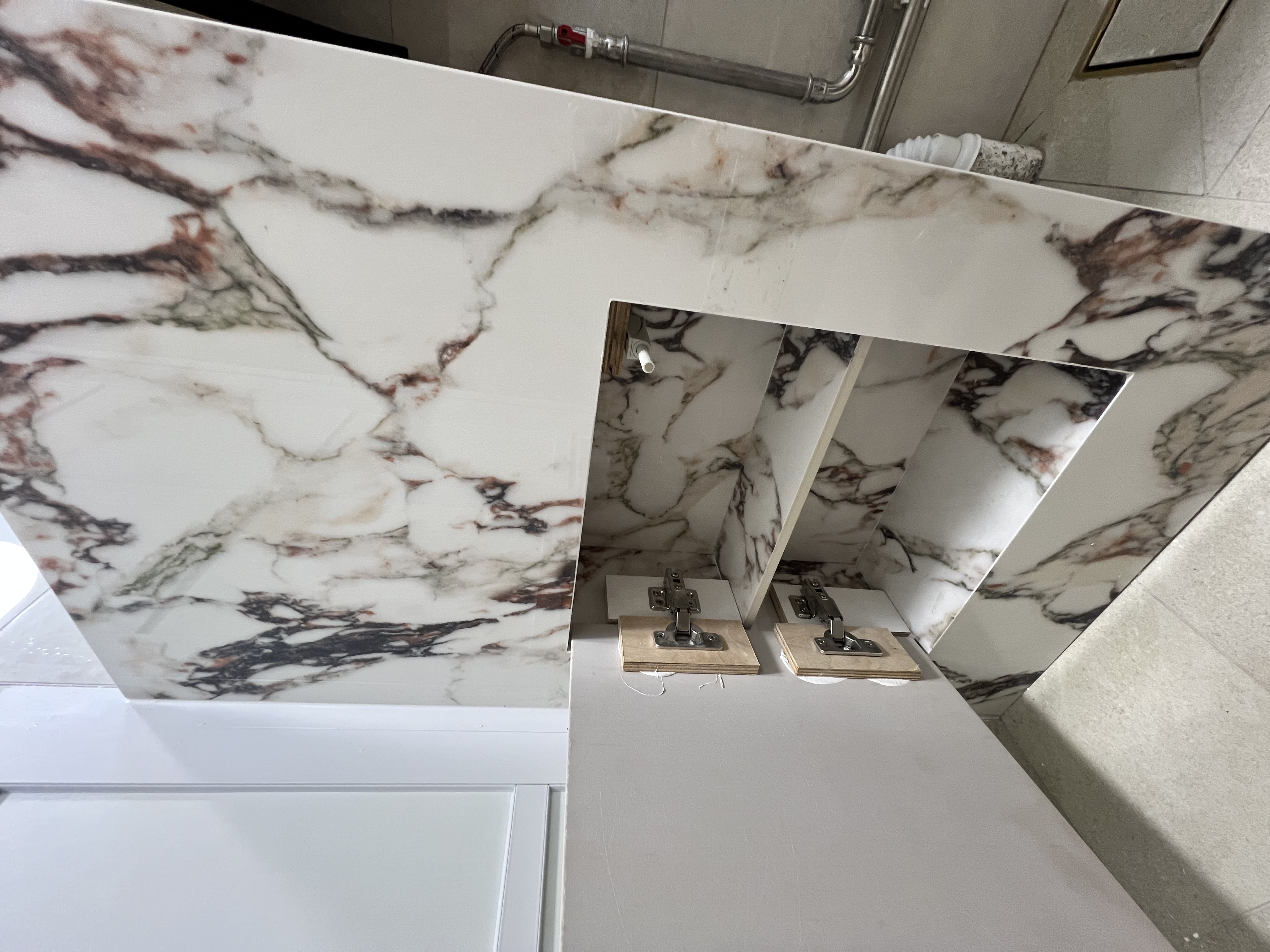 Desert Dreams: A Dune-Inspired Oasis with a Bold Vanity! - Marble-patterned bathroom vanity, white marble countertop, modern