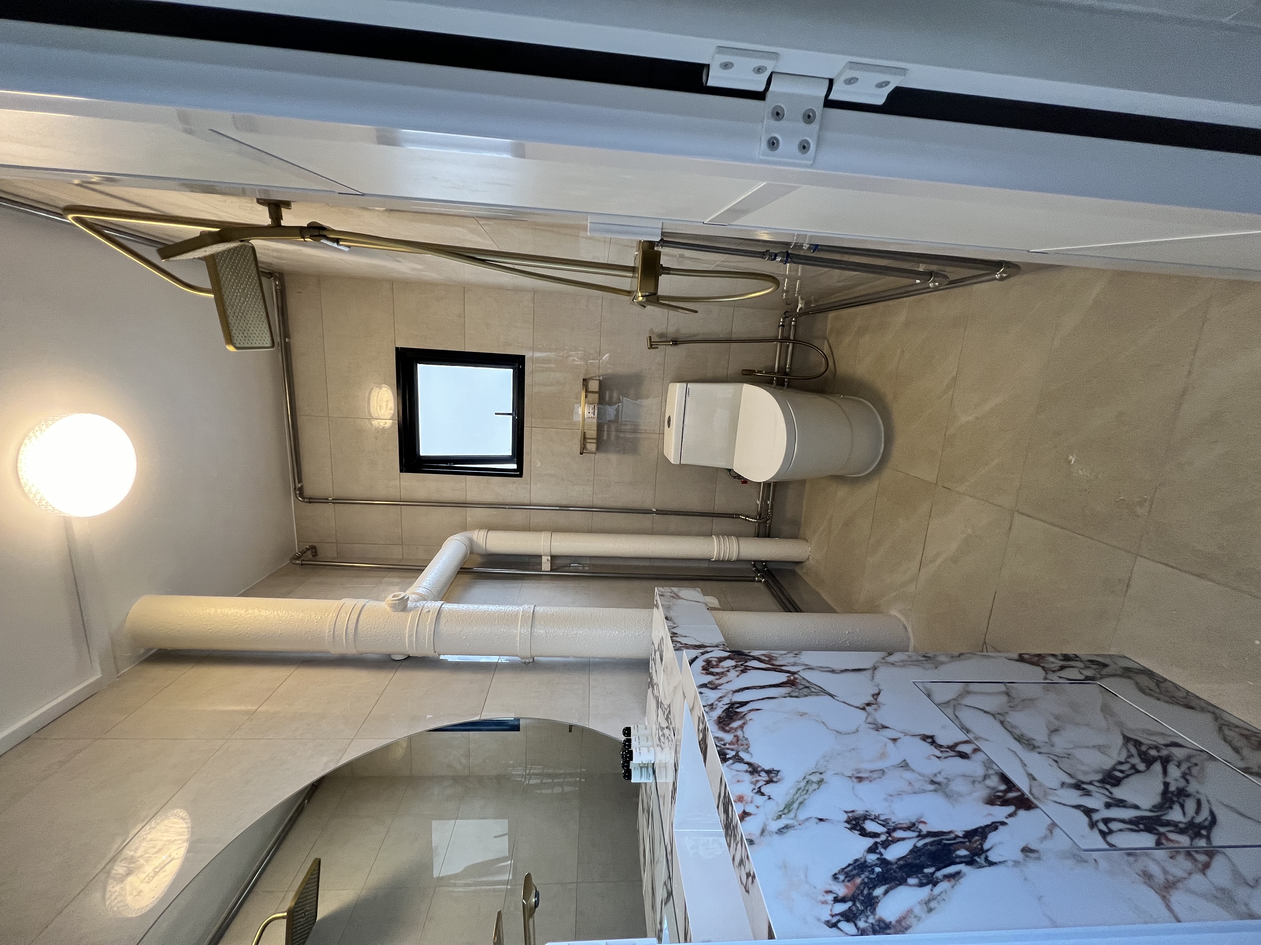 Desert Dreams: A Dune-Inspired Oasis with a Bold Vanity! - Modern bathroom with sleek design, beige tiled walls and floor