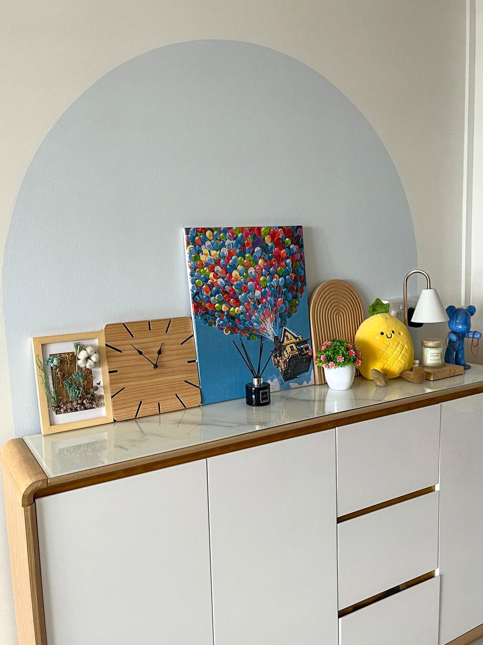 Create a unique home with customised artwork  - Floating art piece, colorful balloons, abstract painting, wooden clock, white