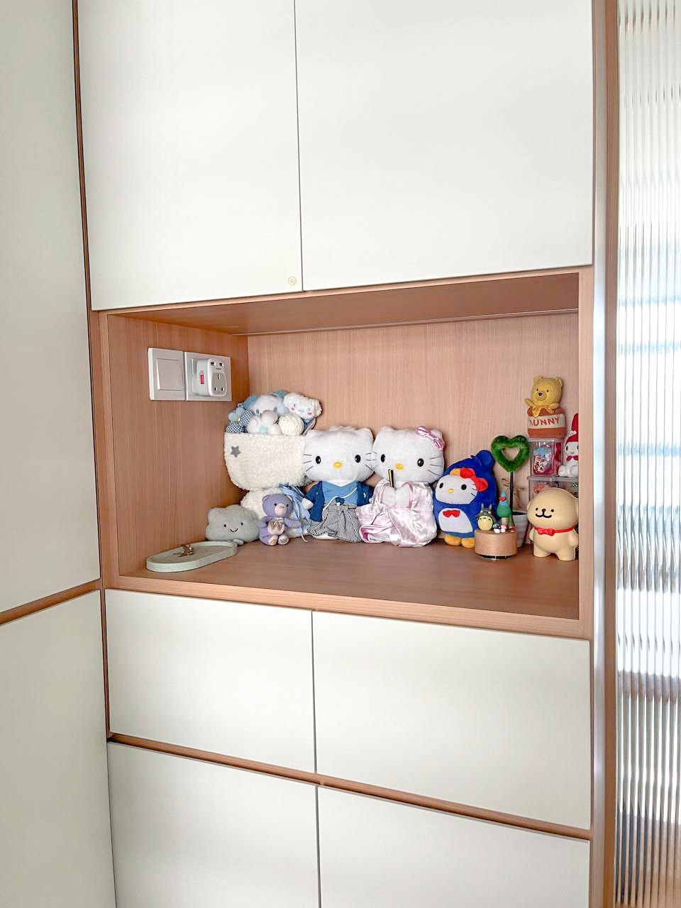 Create a unique home with customised artwork  - Wooden shelf, white cabinets, Hello Kitty collection, plush toys, teddy bear