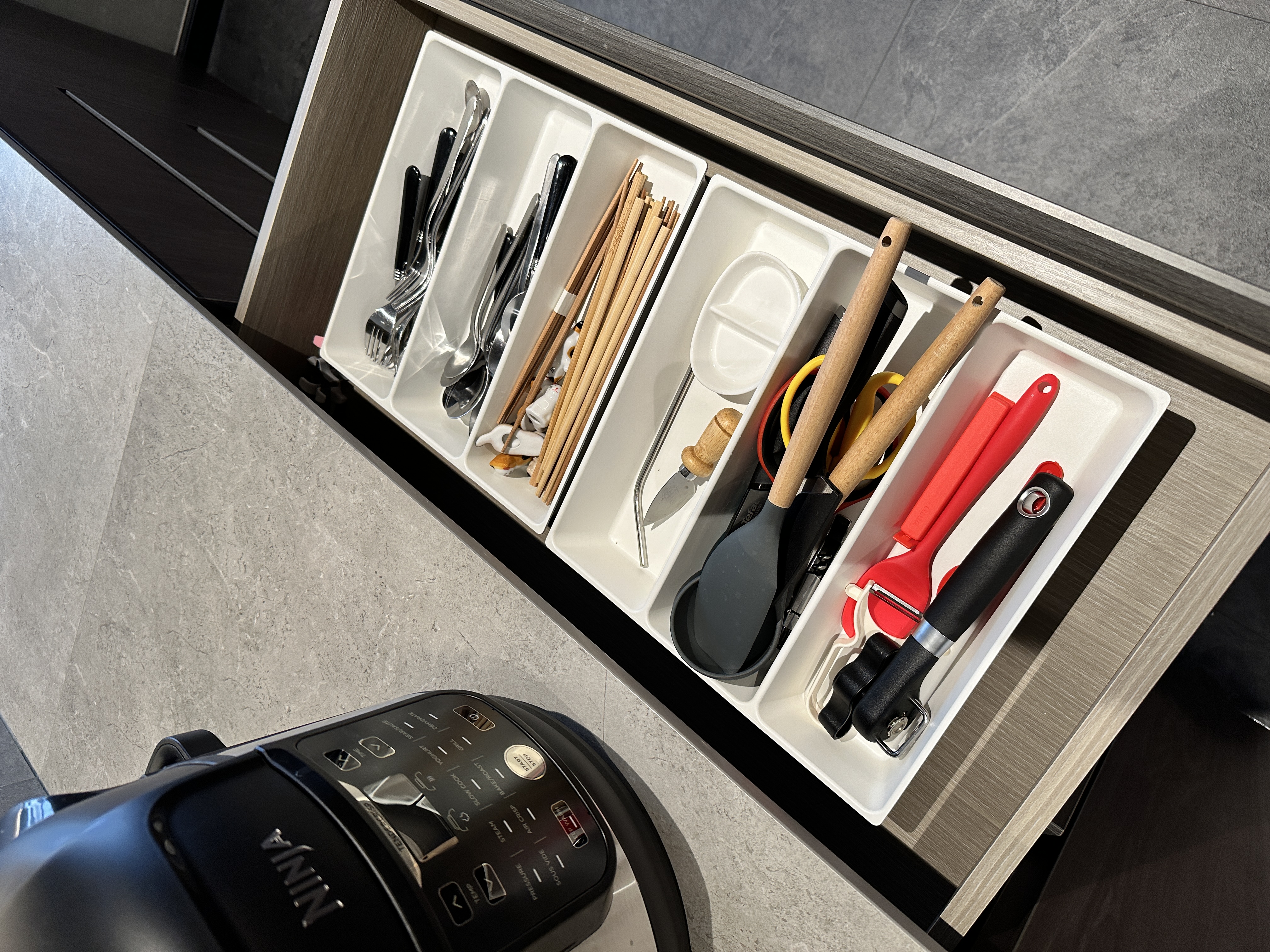 Maximizing Space with Style: Our Minimalist Luxe Kitchen Setup - storage bin, kitchen utensils, organized drawer, stainless