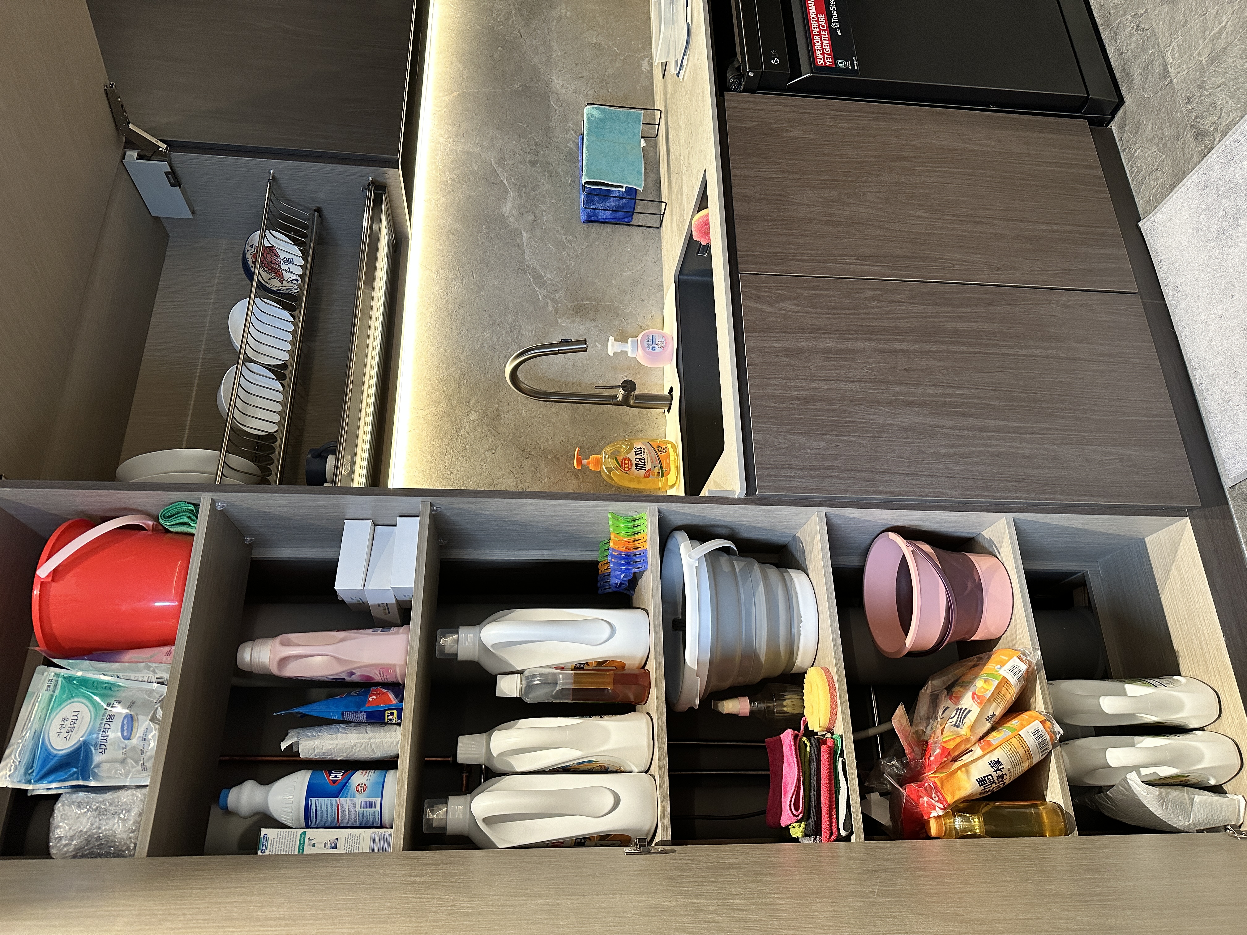 Maximizing Space with Style: Our Minimalist Luxe Kitchen Setup - cleaning supplies, dish rack, dish soap, sponge, dish