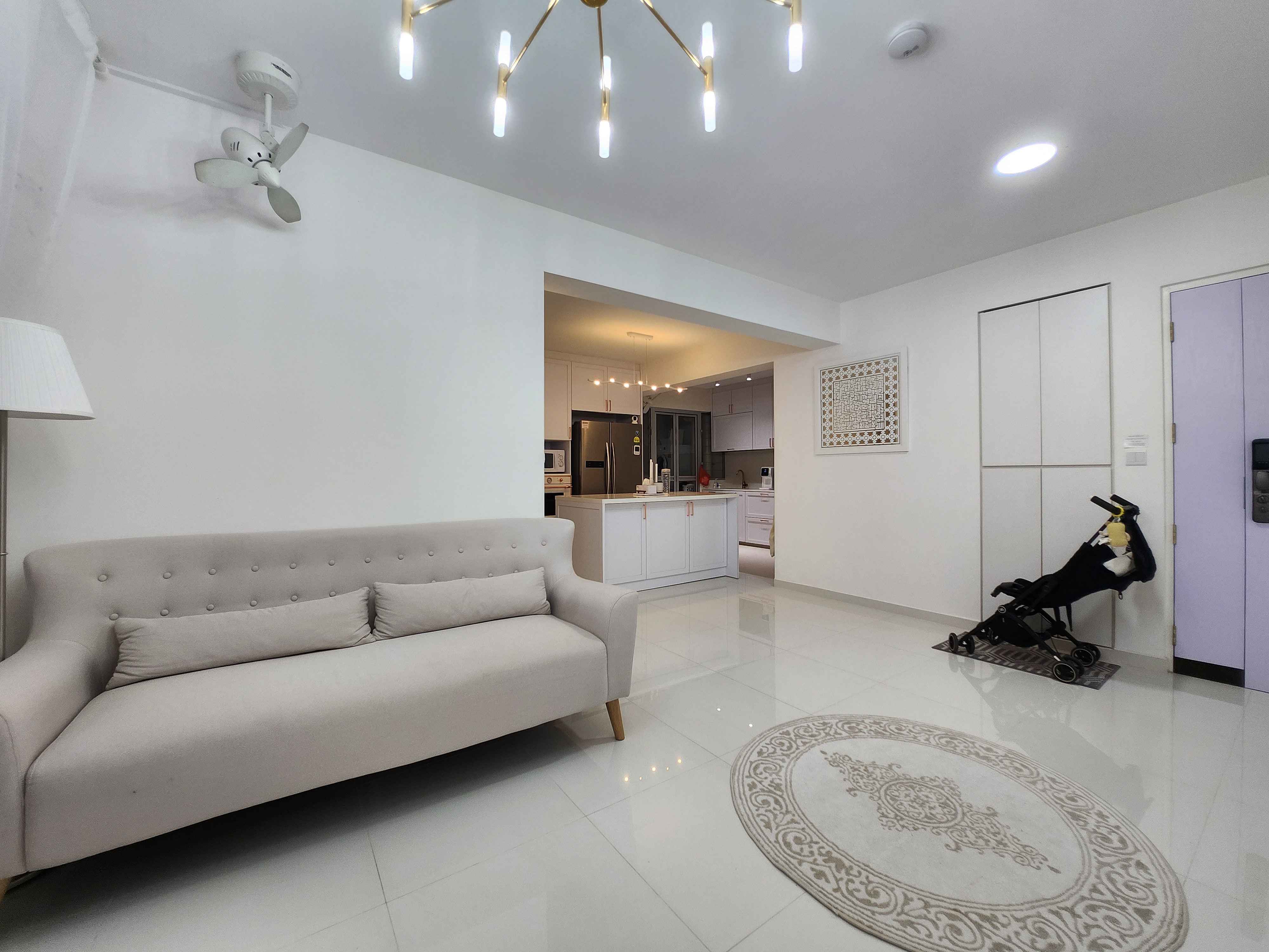 Lightings by punggoHField - Modern minimalist living room with sleek white furniture, elegant chandelier, and contemporary