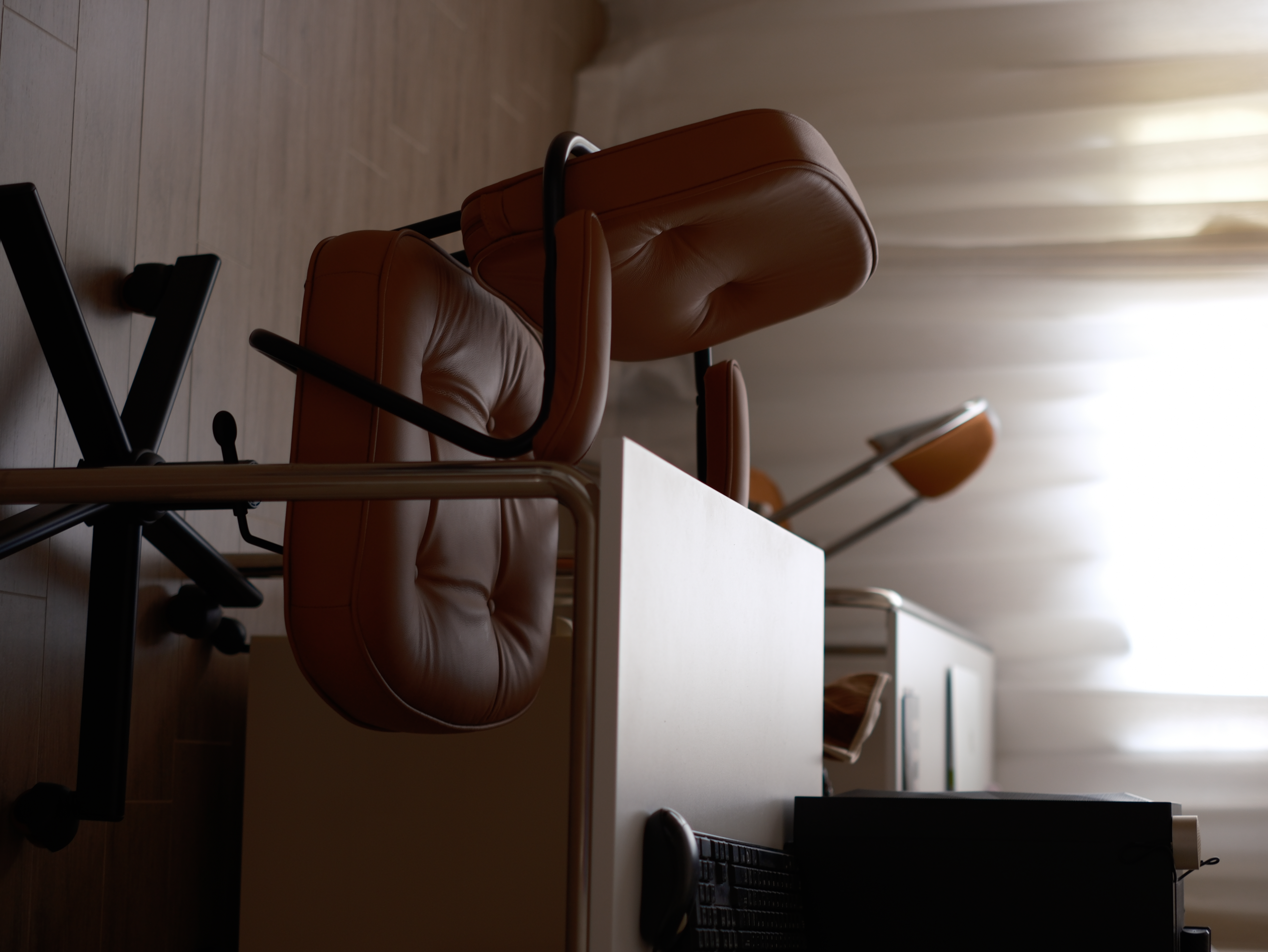 Blending Wardrobe and Study in One Space - Modern office chair, brown leather upholstery, ergonomic design, adjustable