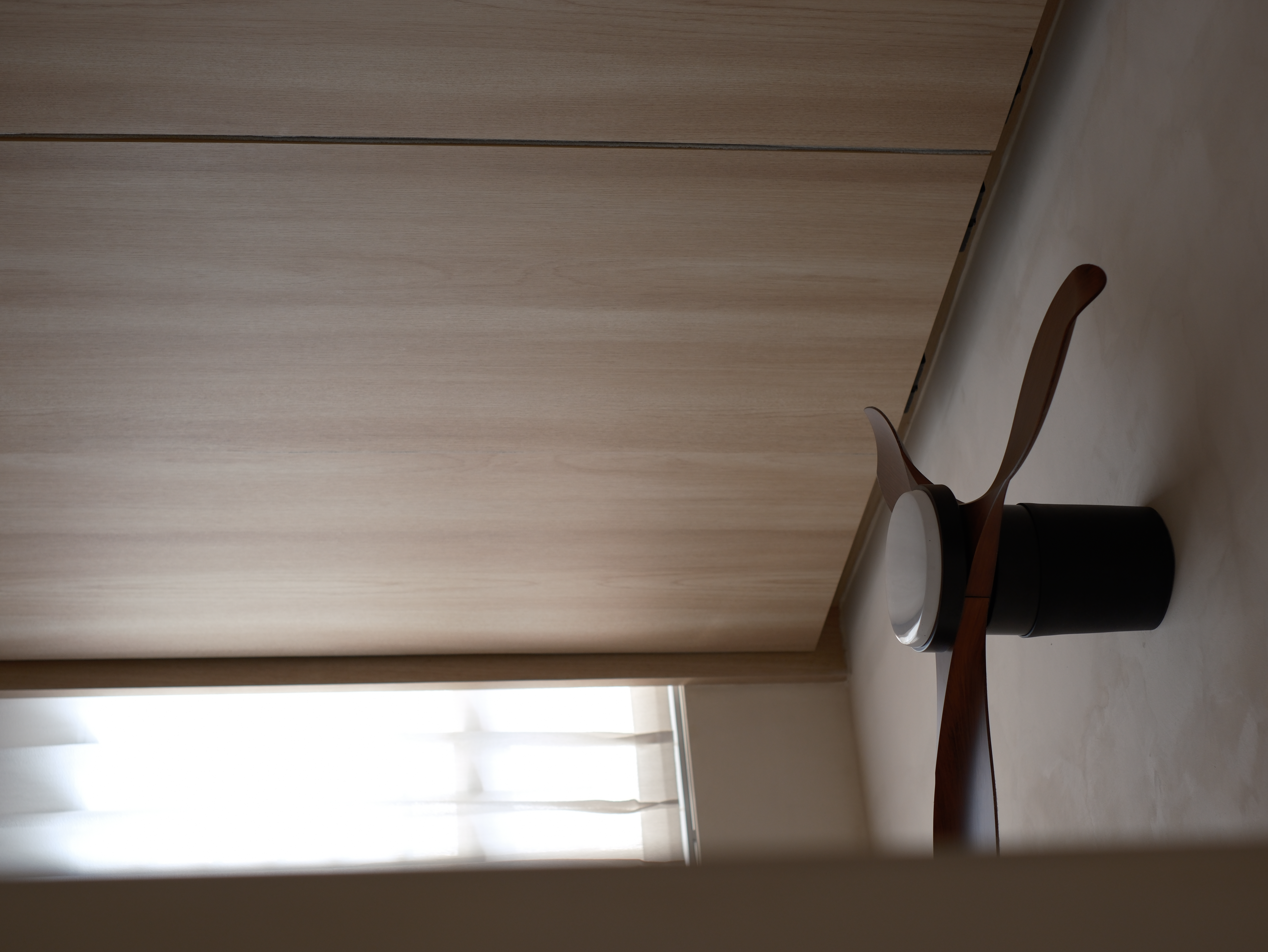 Blending Wardrobe and Study in One Space - Wooden ceiling, light streaming, shadow cast, modern design, minimalist decor