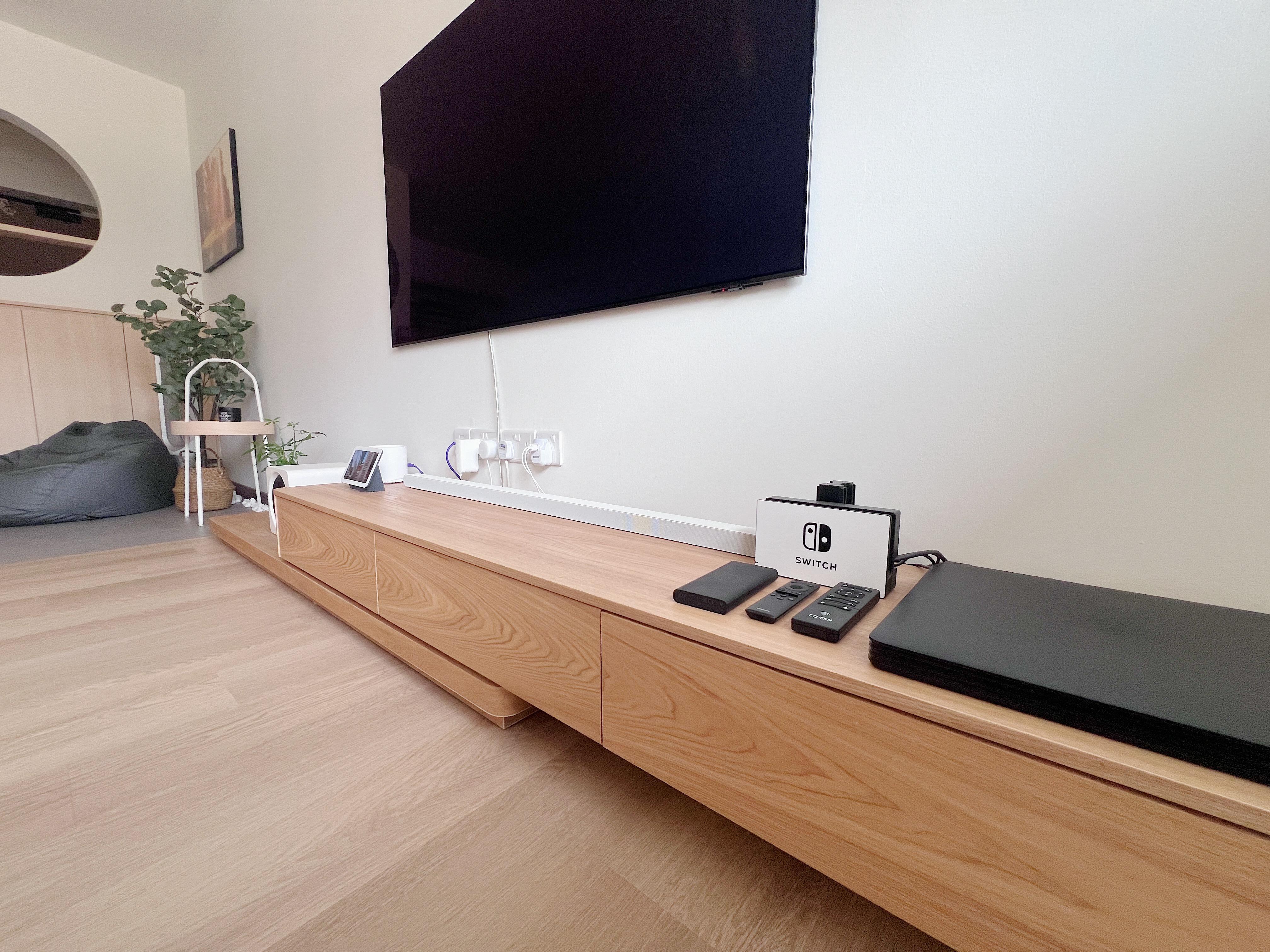 Cozy corner for a warm cup of tea and a good book  - Wooden entertainment console, modern living room, minimalist decor
