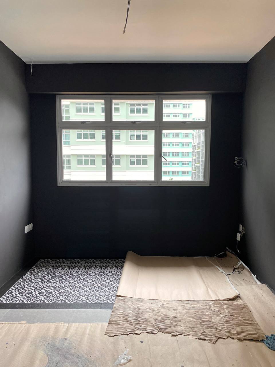 Why we will definitely get an ID for renovation!  - Dark gray walls, large window, light green building, multi-story