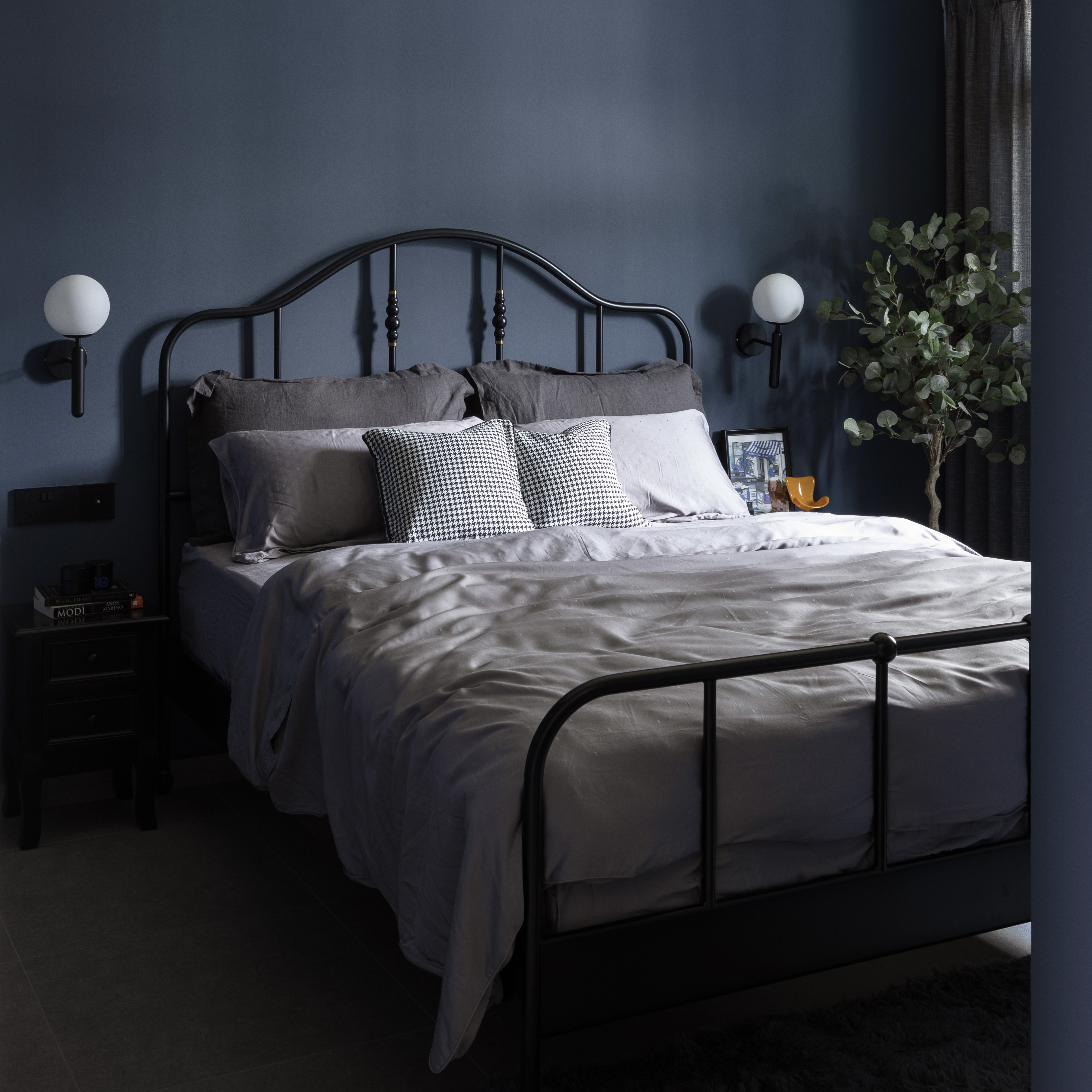 Why we will definitely get an ID for renovation!  - Dark blue wall, modern bed, black metal frame, gray bedding, houndstooth