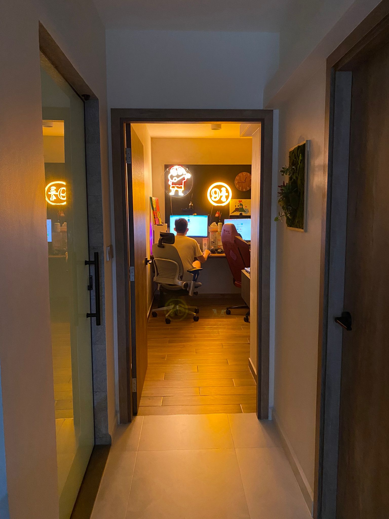 Our cozy gaming corner: with Lan shop vibes, said the man in his 30s - dimly lit hallway, cozy room, home office, person