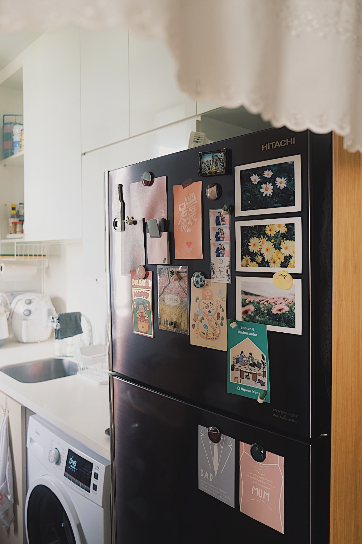 How we make a tiny condo kitchen functional and aesthetic - Magnetic refrigerator adorned with various photos and notes