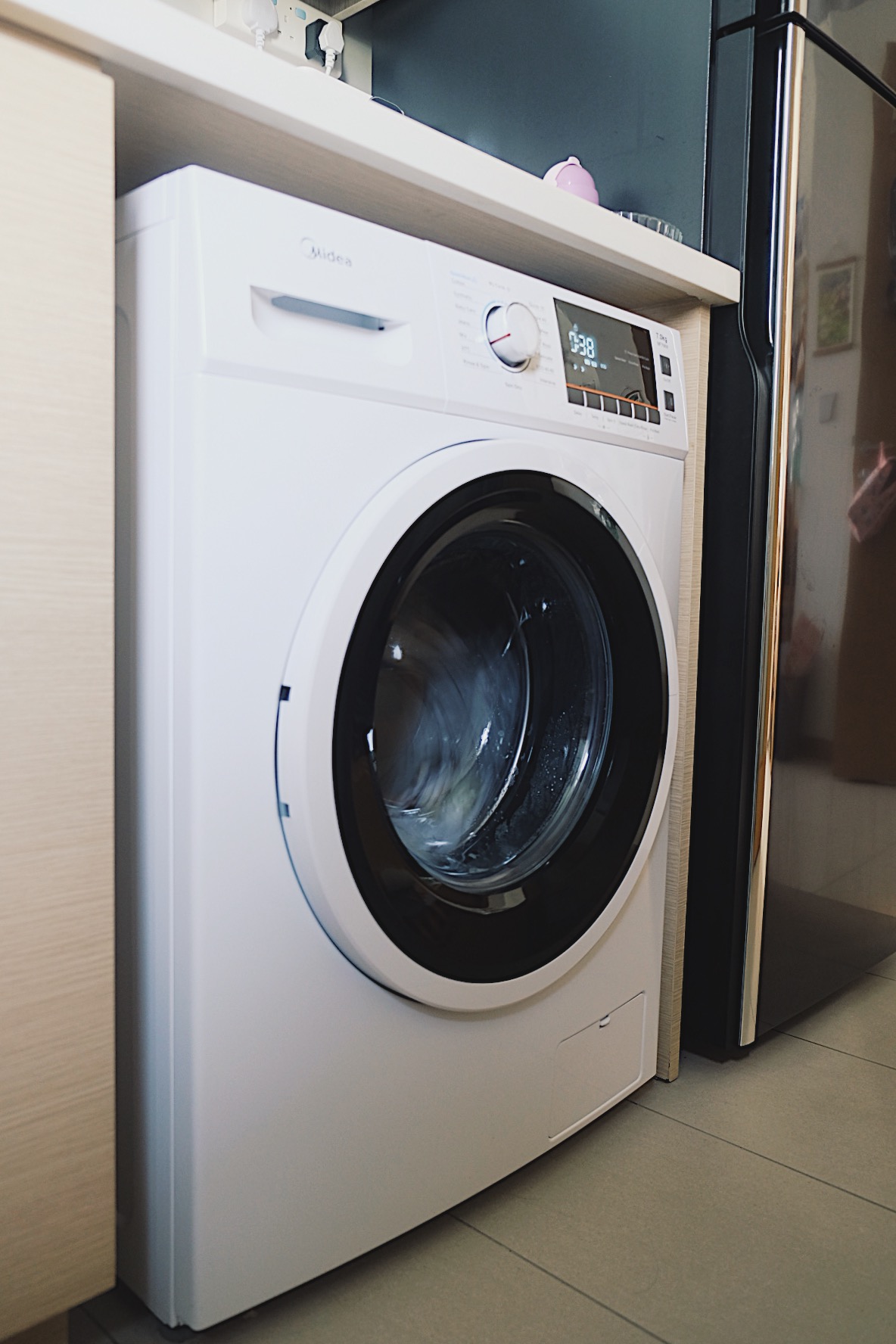 How we make a tiny condo kitchen functional and aesthetic - Modern kitchen washer, sleek appliance, white color, digital