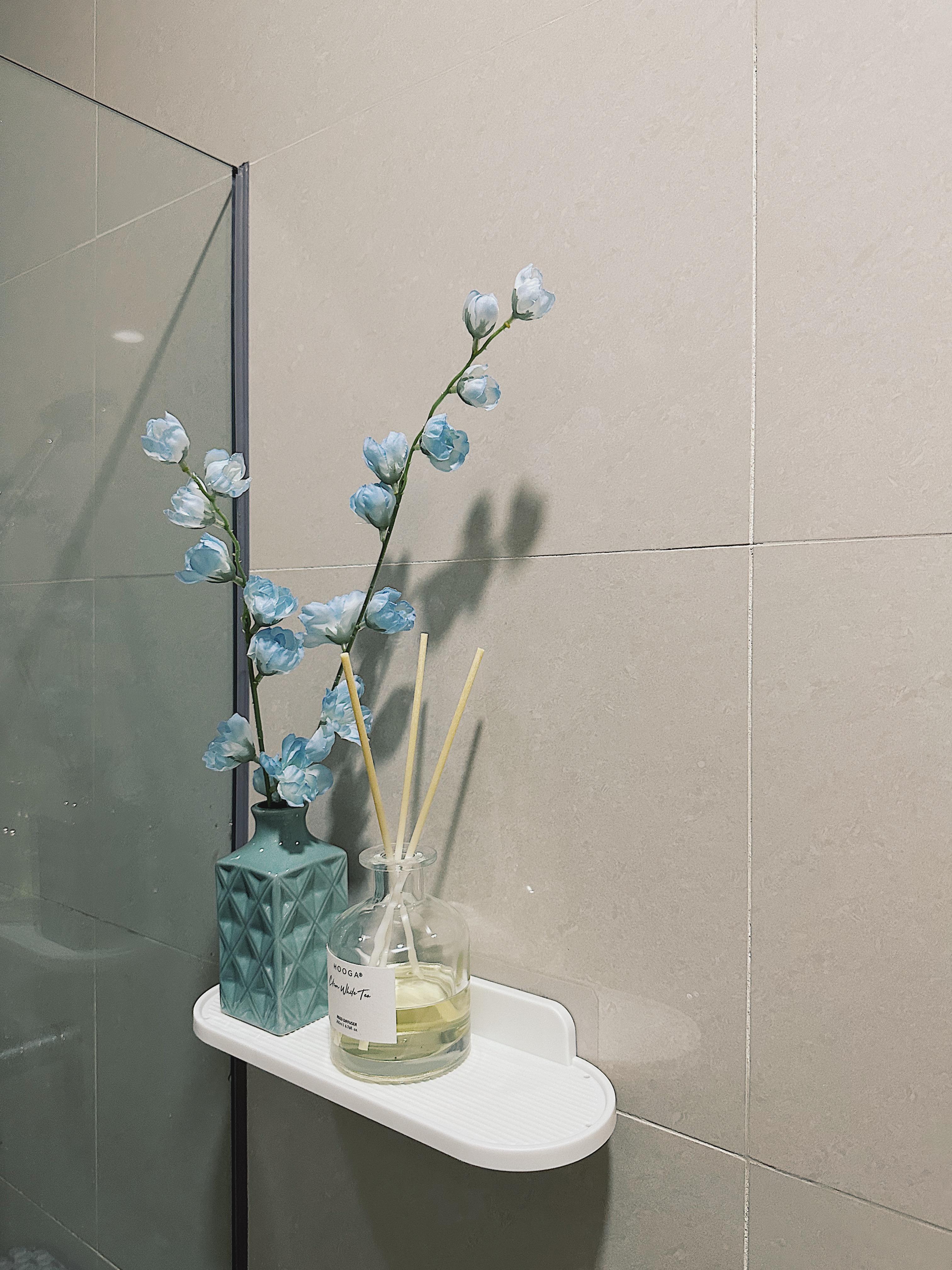 Styling our bathrooms with framed magazine cutouts - vase, blue flowers, glass vase, white shelf, bathroom, modern decor