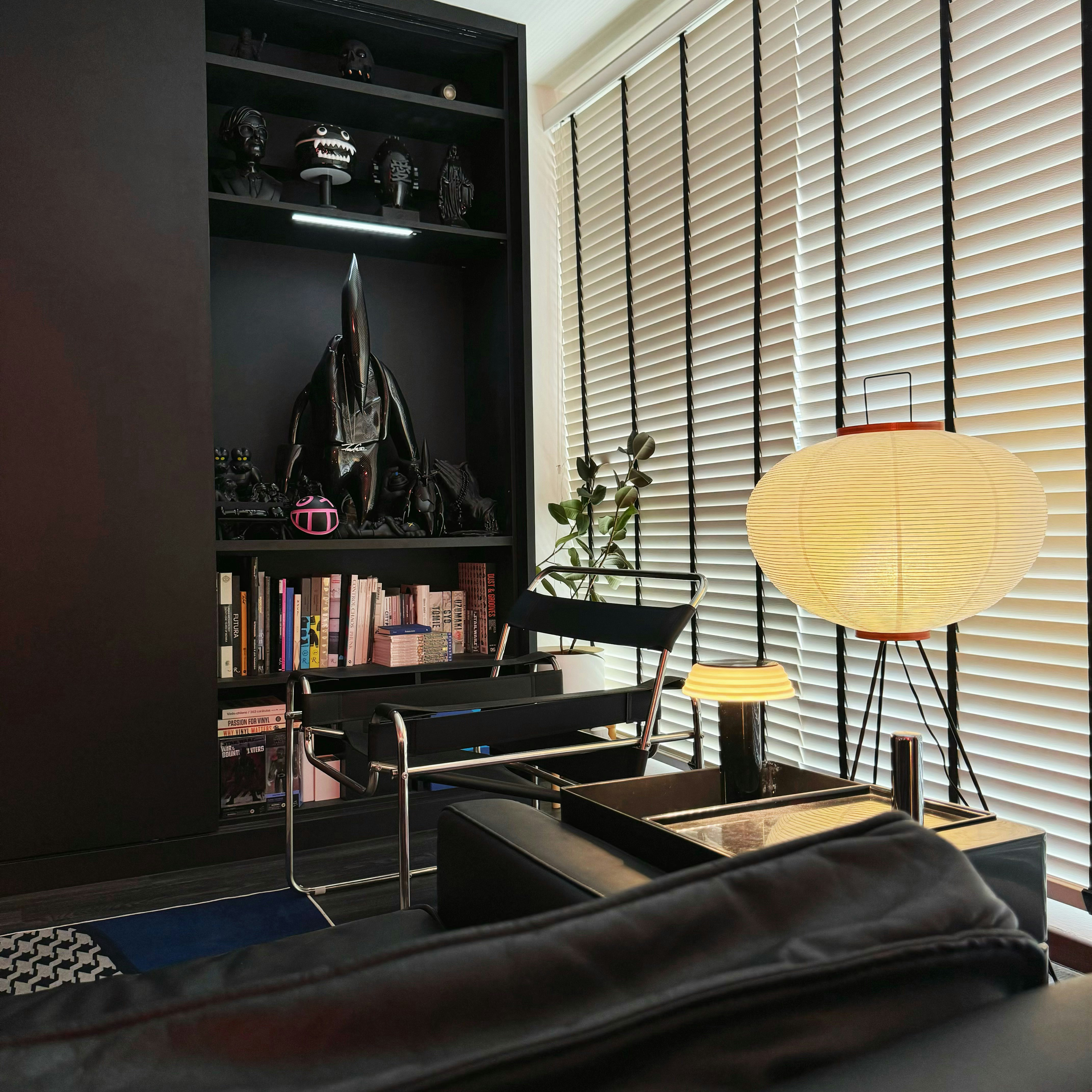 A Dark Mid-Century Modern Living Room That’s a Canvas of Creativity - Modern living room, contemporary decor, black