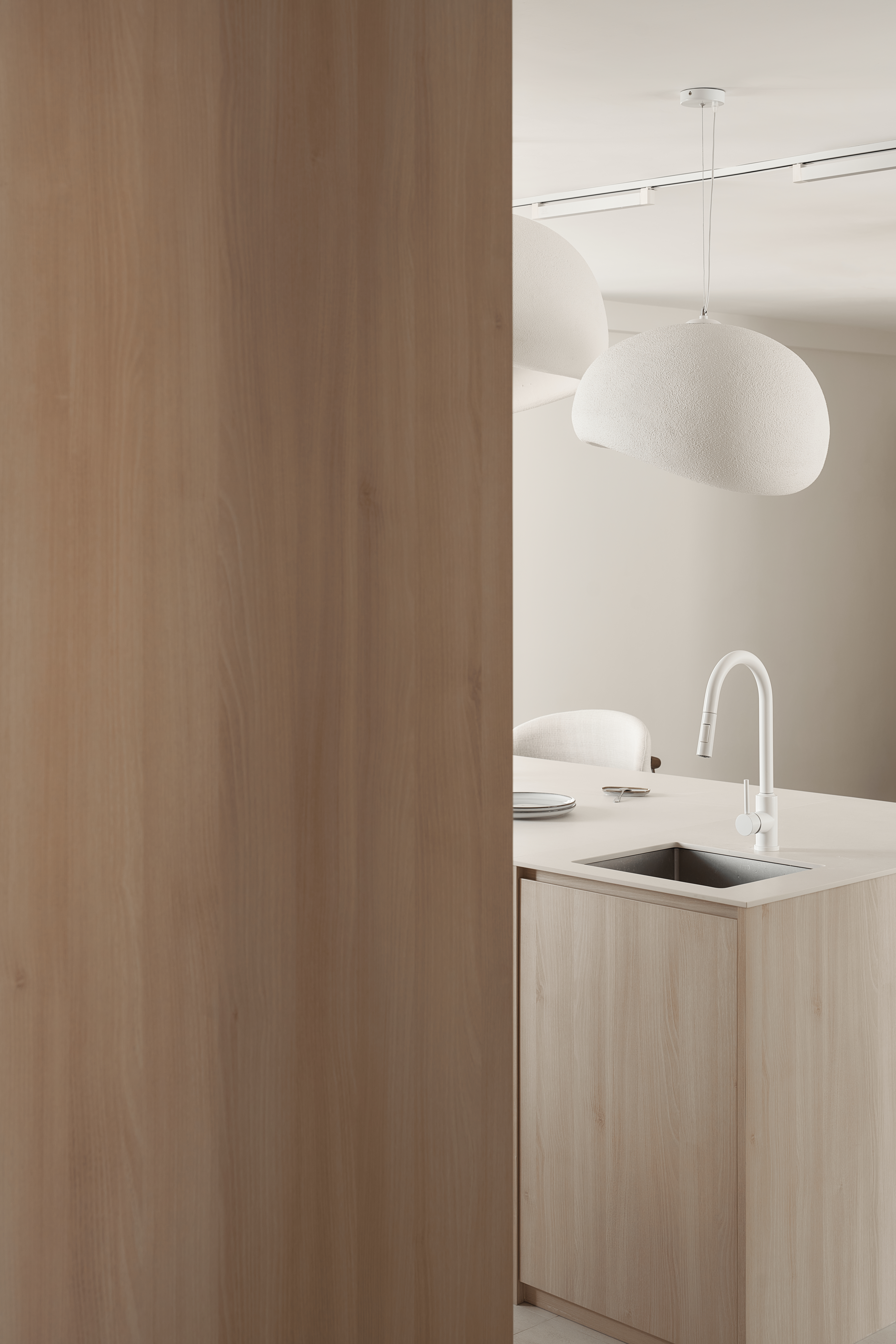 A Scandinavian-Inspired Haven of Modern Elegance - Wooden kitchen cabinetry, minimalist design, modern kitchen, white