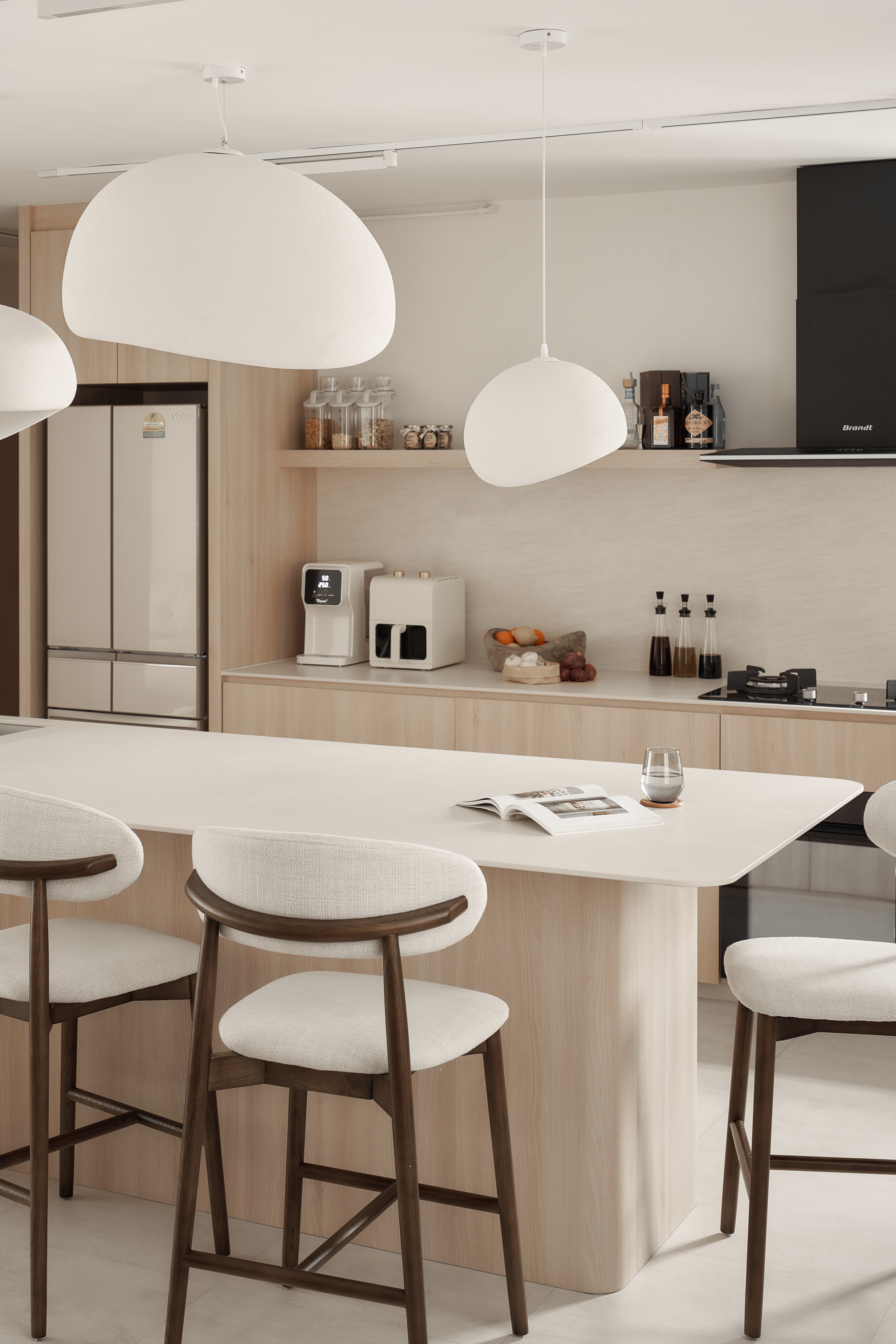 A Scandinavian-Inspired Haven of Modern Elegance - Modern kitchen with minimalist design, white pendant lights, sleek