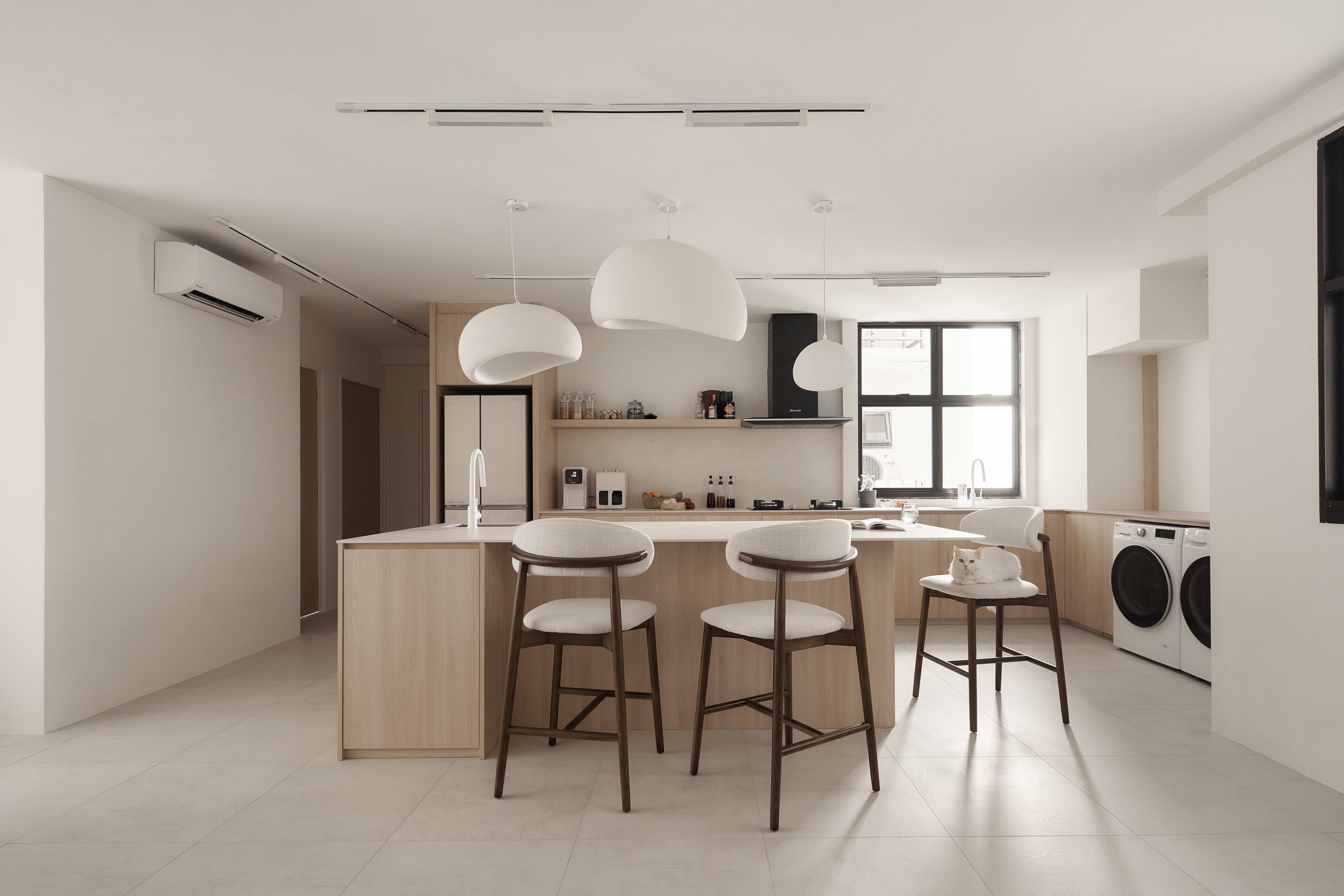 A Scandinavian-Inspired Haven of Modern Elegance - Modern minimalist kitchen with sleek design, white and beige tones, large