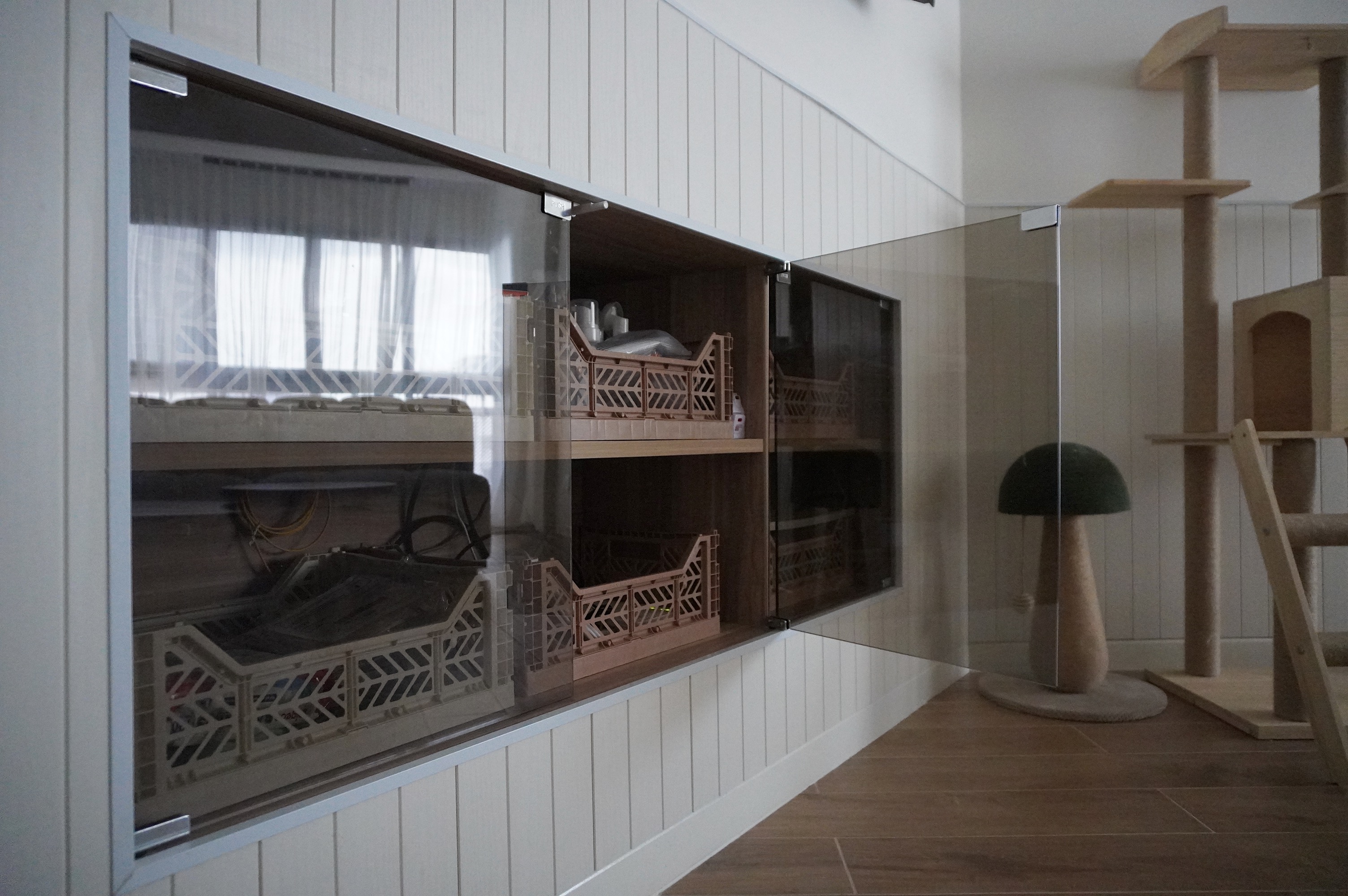 From Barn Door to Panels: Inside Our Modern Farmhouse Living Room - Glass-fronted cabinet, wooden shelves, indoor setting