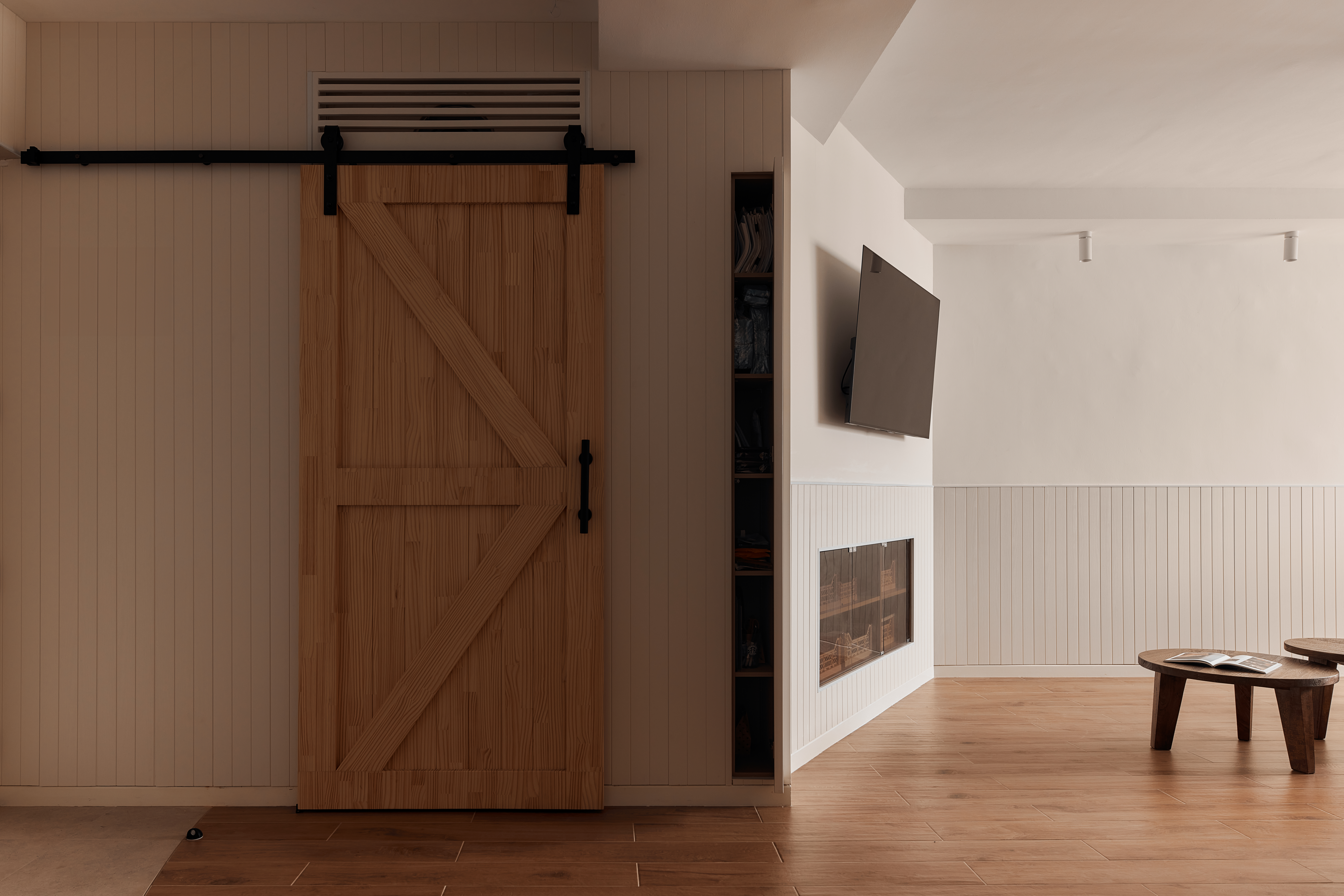 From Barn Door to Panels: Inside Our Modern Farmhouse Living Room - Wooden door, beige walls, black metal frame, wooden