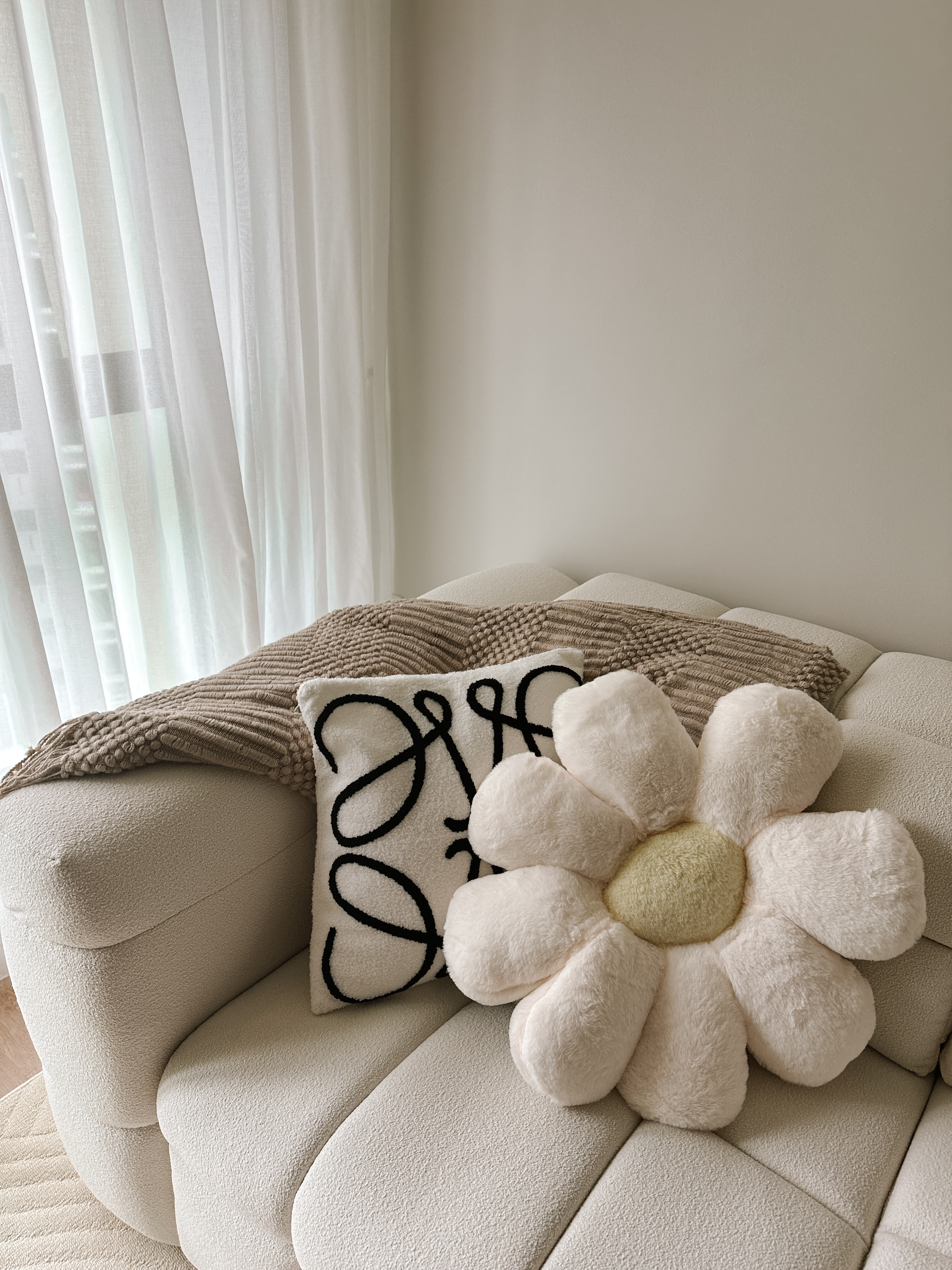 Our Cosy Living Room: No Built-Ins and 90% Taobao Furniture - Cream sofa, beige cushions, white and black pillow, floral