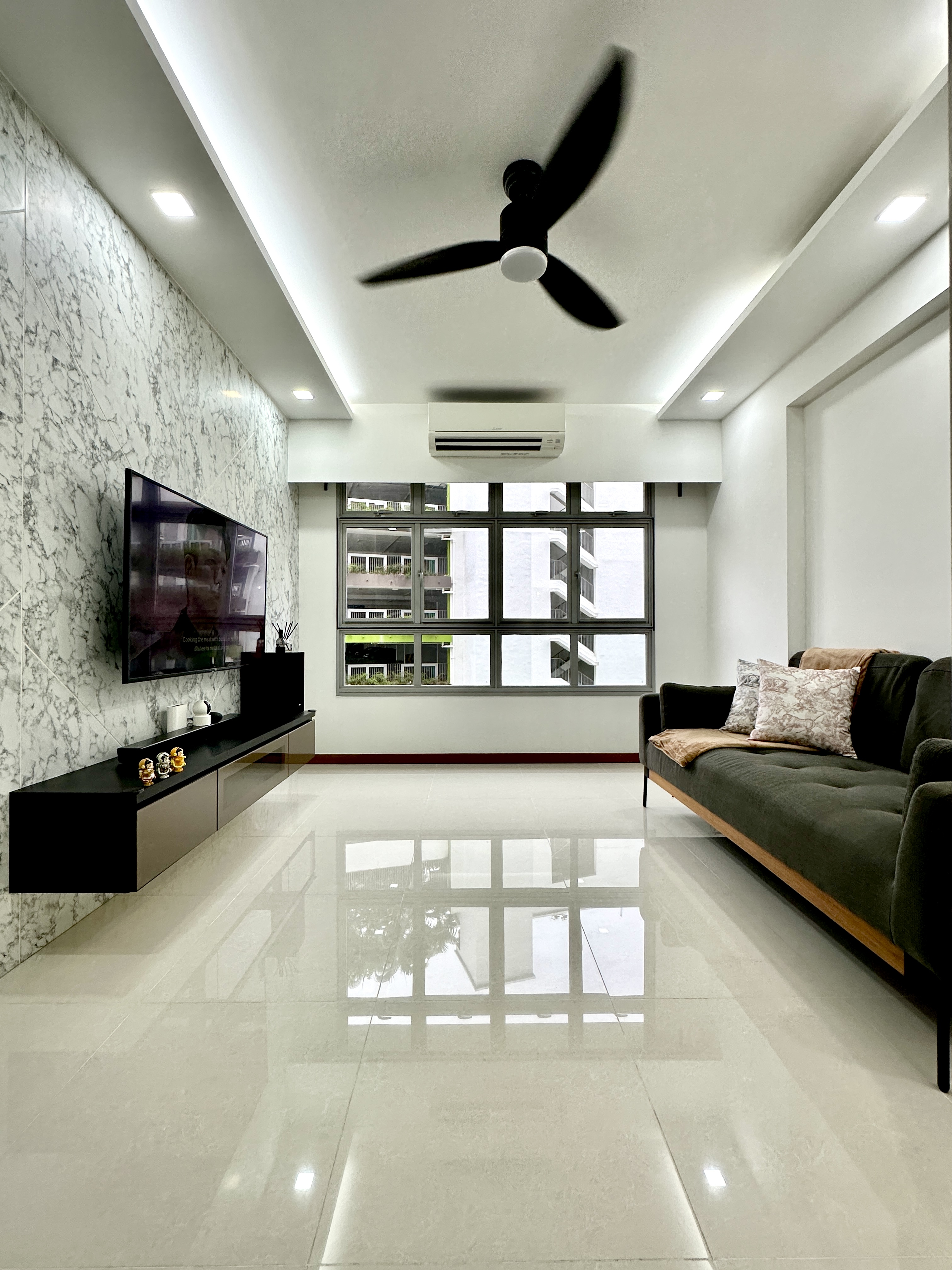 Netflix & Unwind: My Cozy Minimalist Vibe! - Modern living room with sleek design, marble accent wall, large flat-screen TV