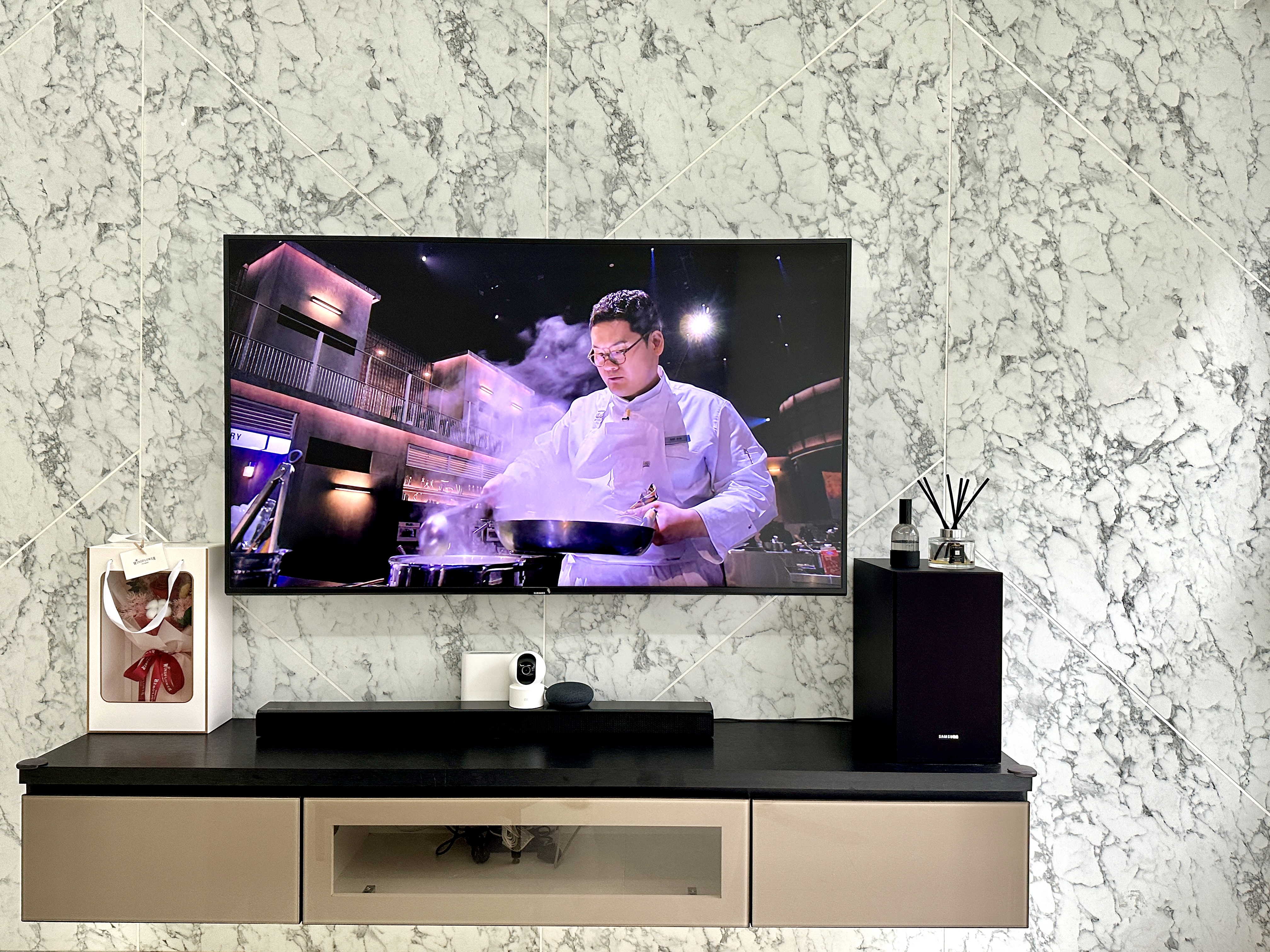 Netflix & Unwind: My Cozy Minimalist Vibe! - Marble-textured wall, modern living room, sleek entertainment center, black and