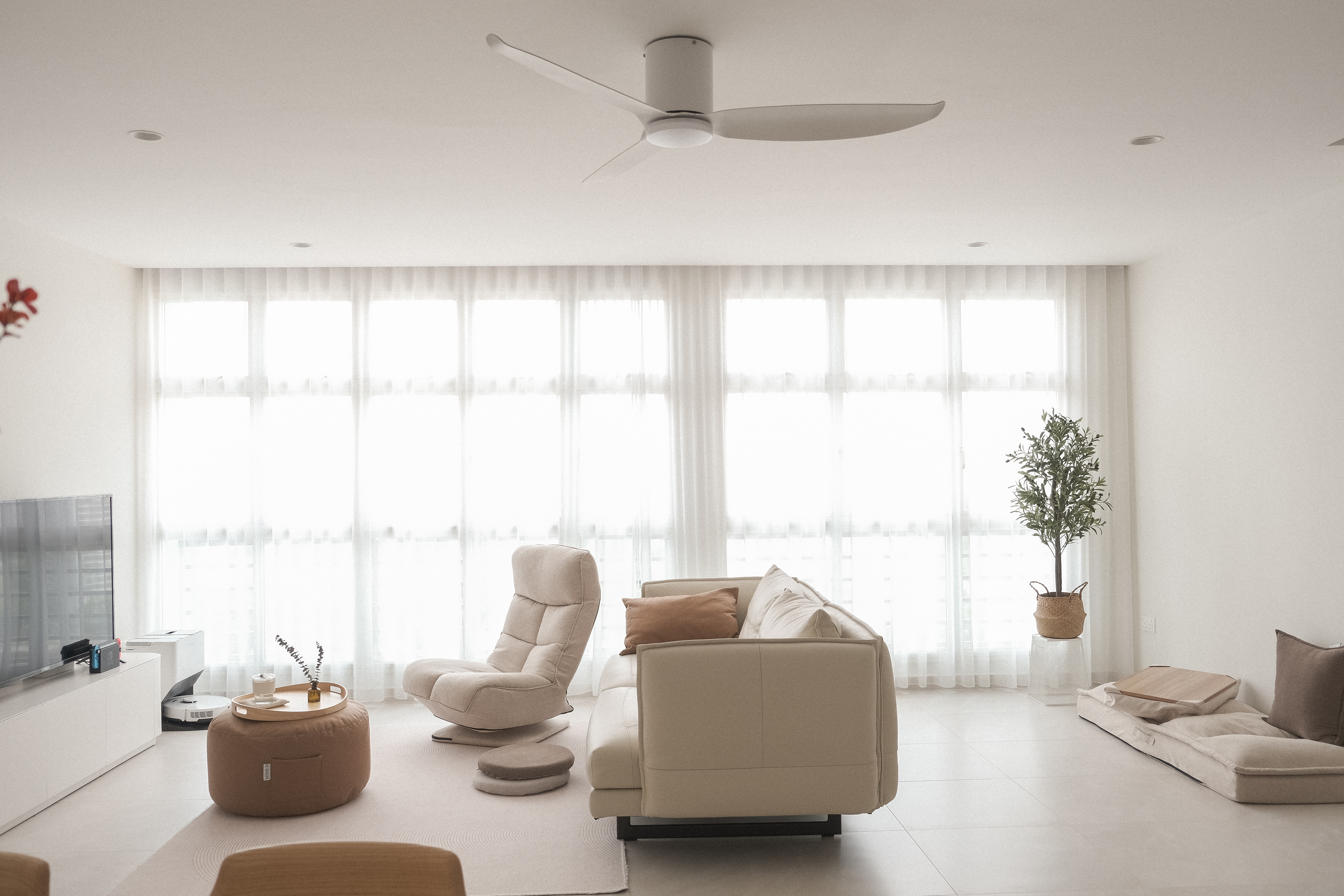 No Built-Ins, Just Space: A Cosy 'White' Living Room  - Modern minimalist living room with large windows, soft natural light