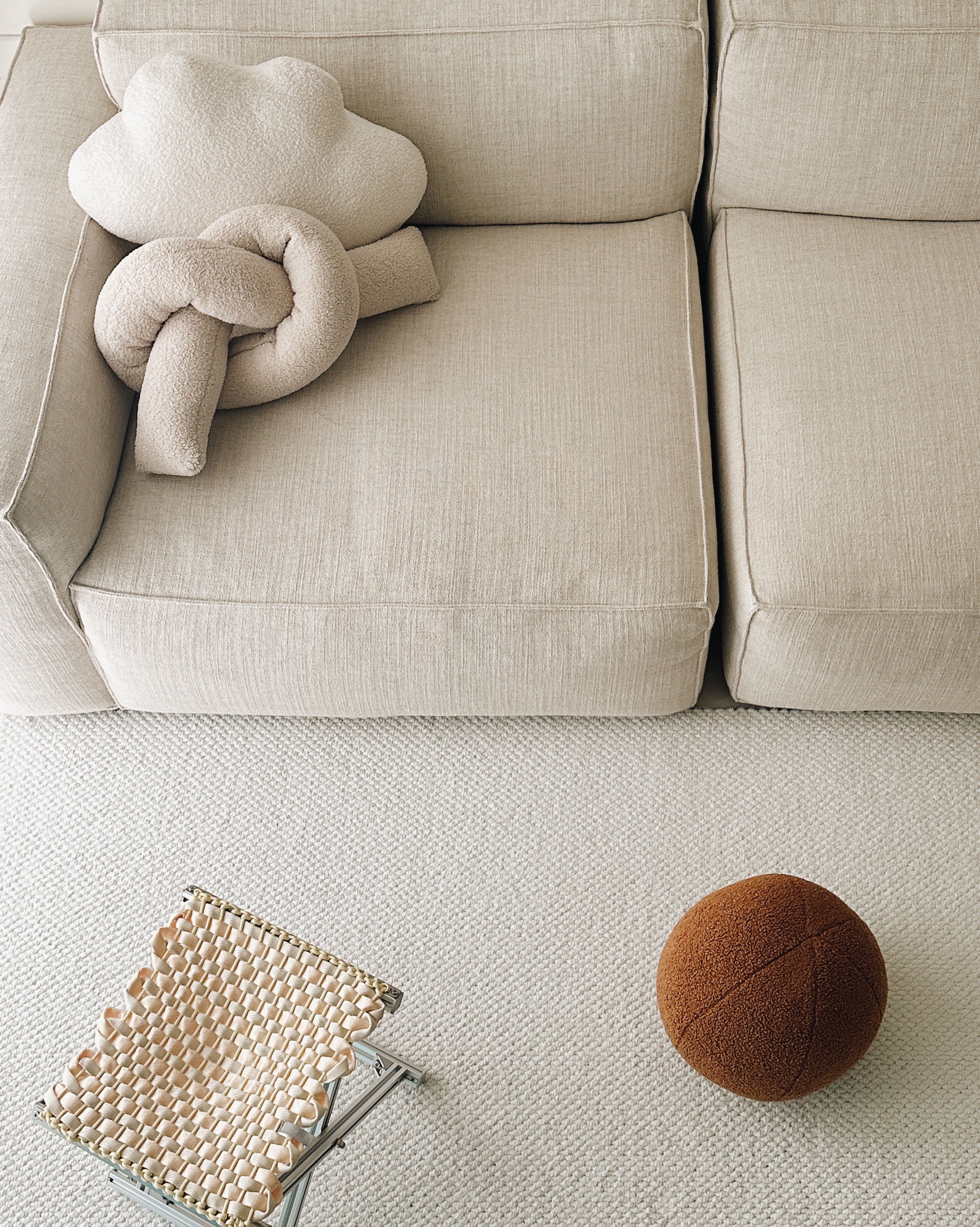 ⁠Modern Minimalist: A Peek into My Living Room - Cream-colored sofa, plush cushions, cozy seating area, soft texture