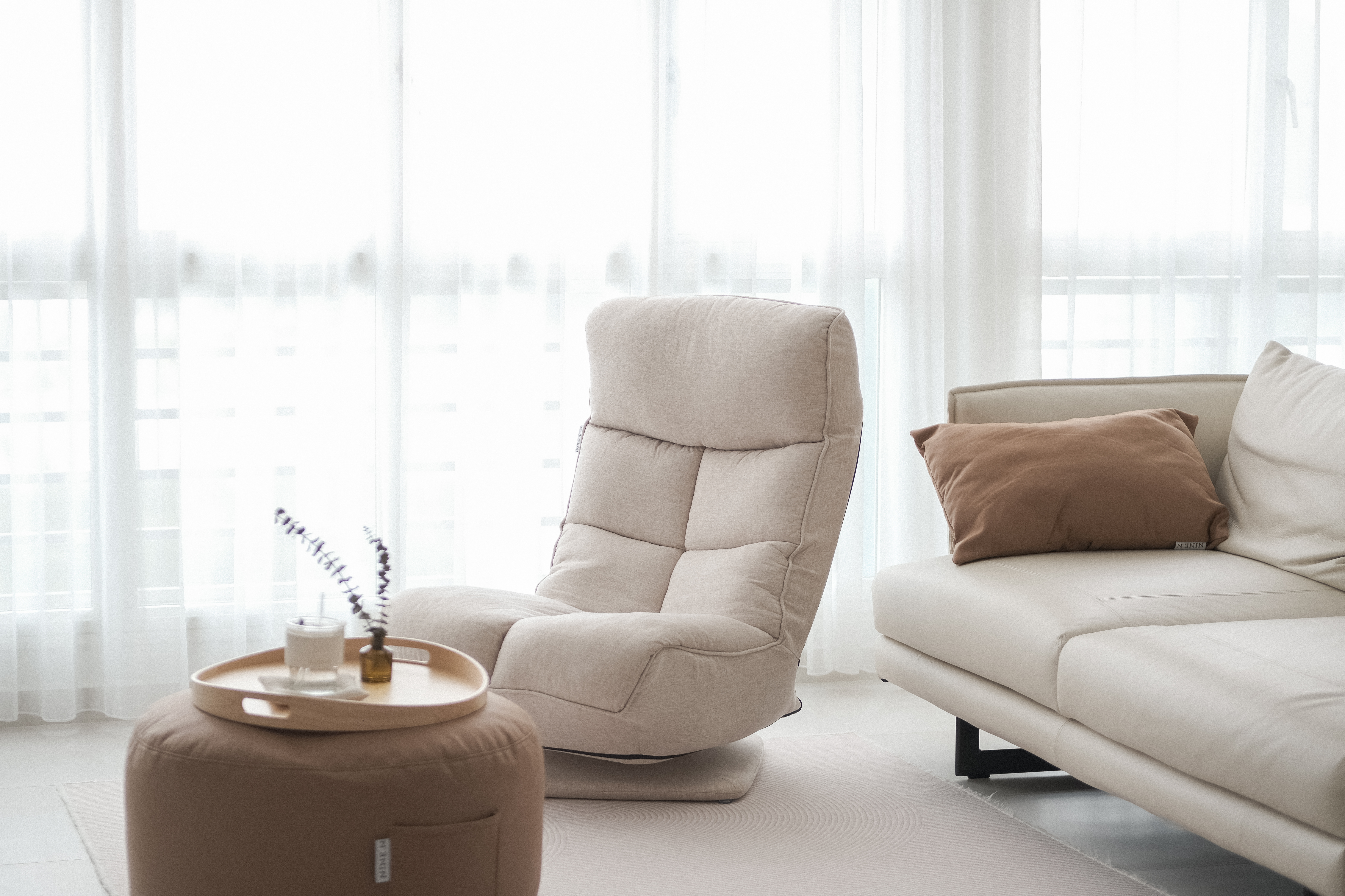 No Built-Ins, Just Space: A Cosy 'White' Living Room  - Soft, beige recliner, minimalist living room, cozy atmosphere