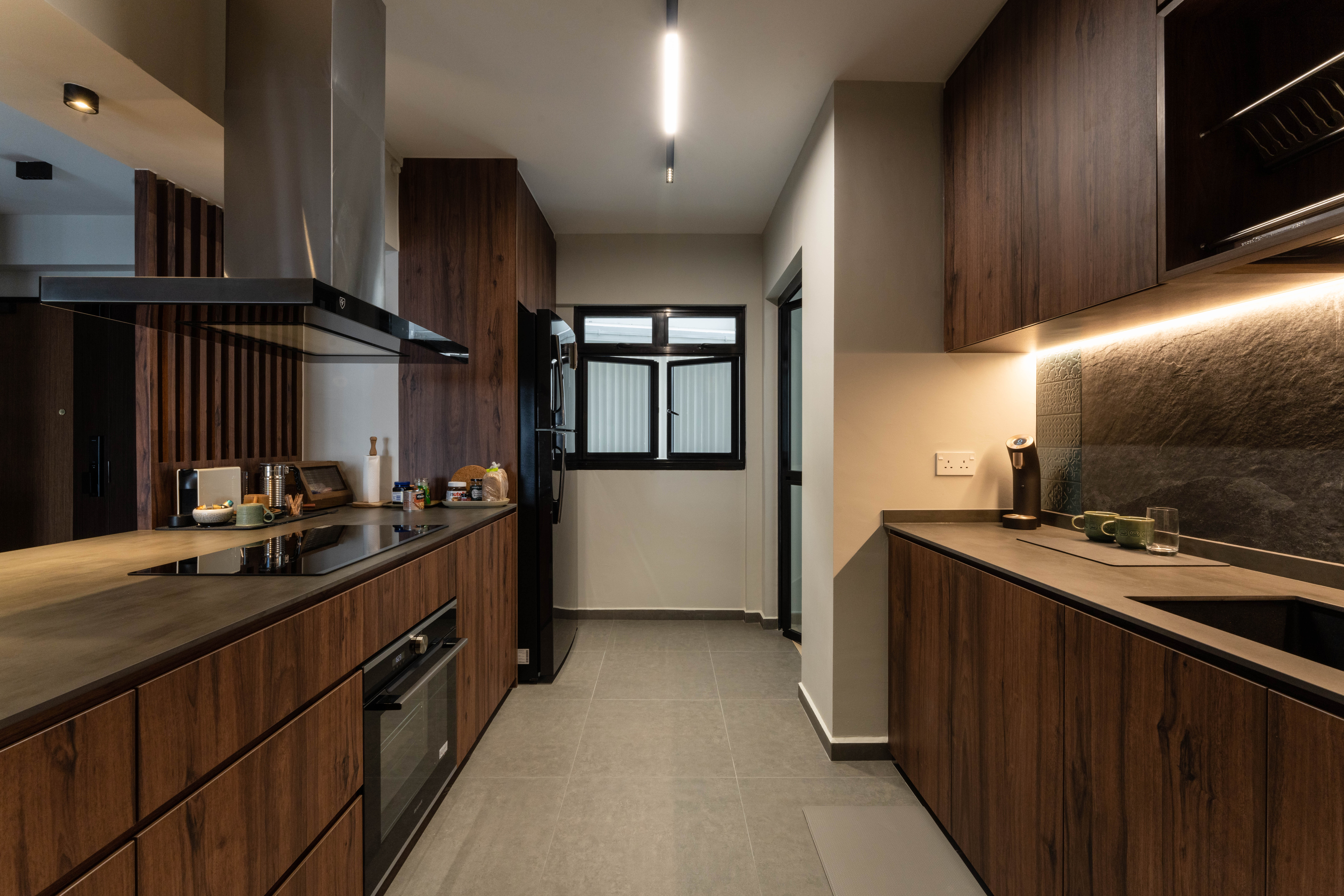 All ready to whip up a storm! - Modern kitchen with dark wood cabinets, stainless steel appliances, sleek black countertops