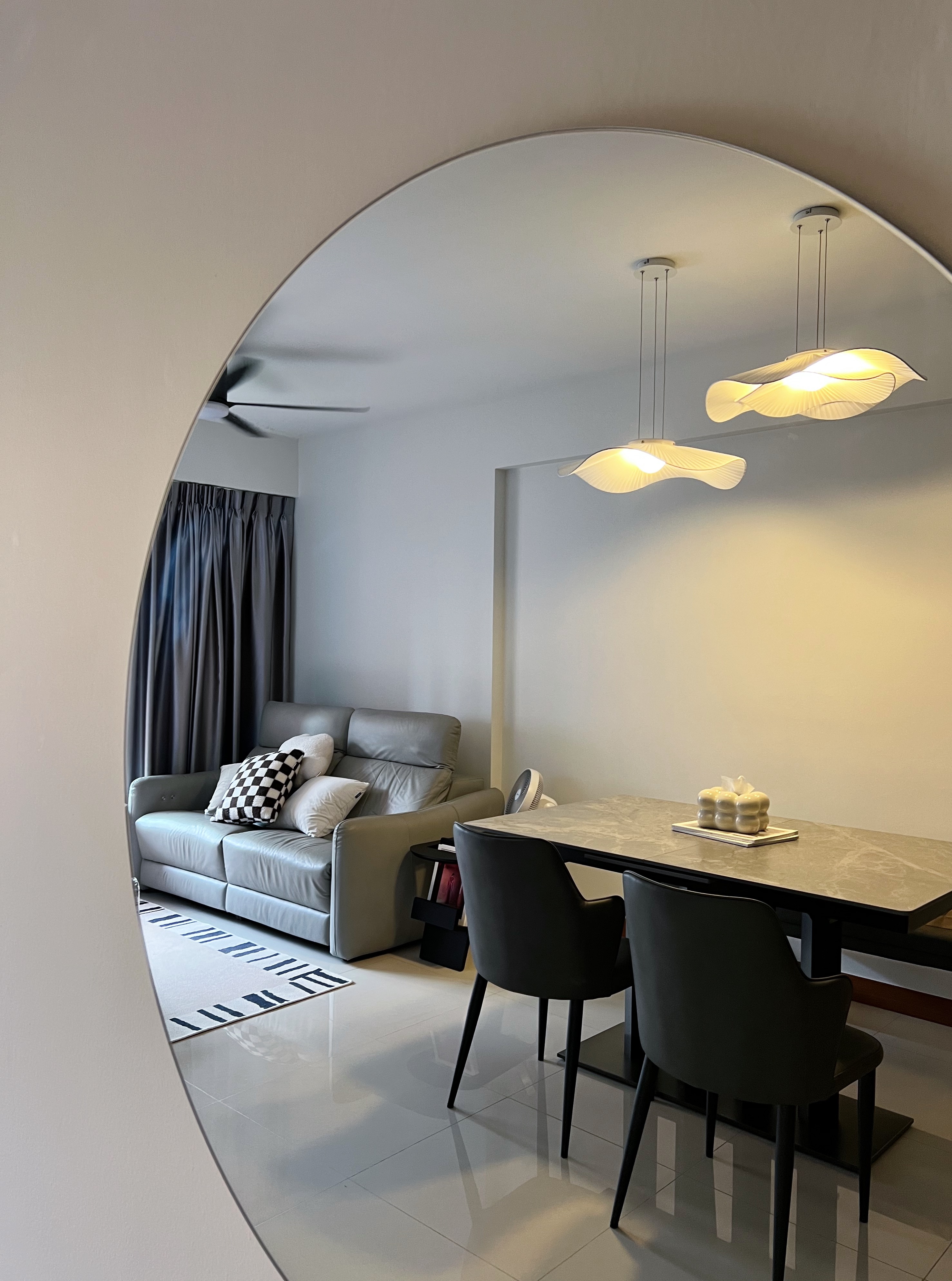 Moody Scandi Retreat — Minimal Built-ins and a Cozy Balcony - Modern living room with gray leather sofa, black and white