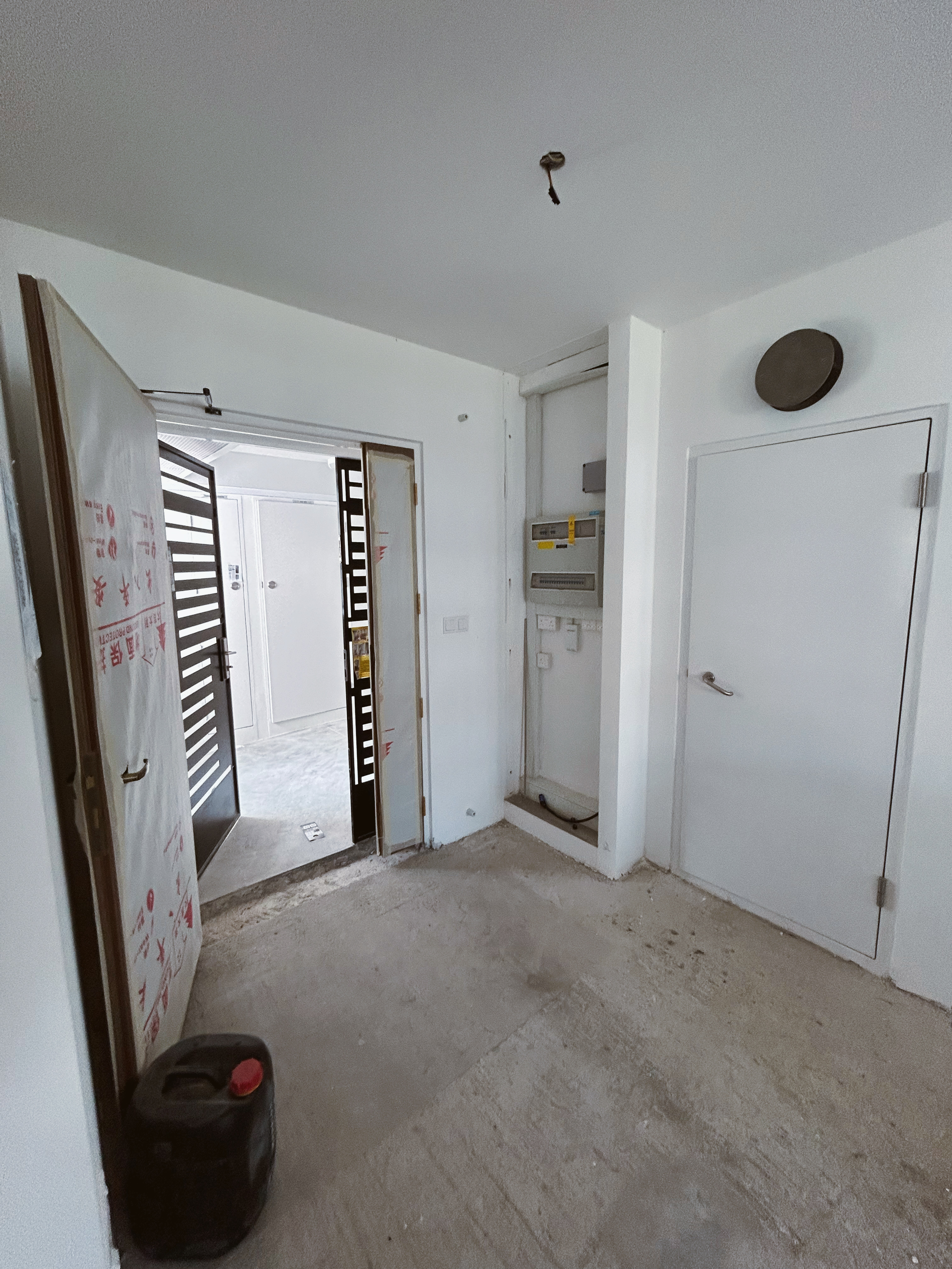 Feng Shui Meets Personal Flair: Our Loafy Haus BTO Adventure! - Interior view of a newly constructed room with white walls