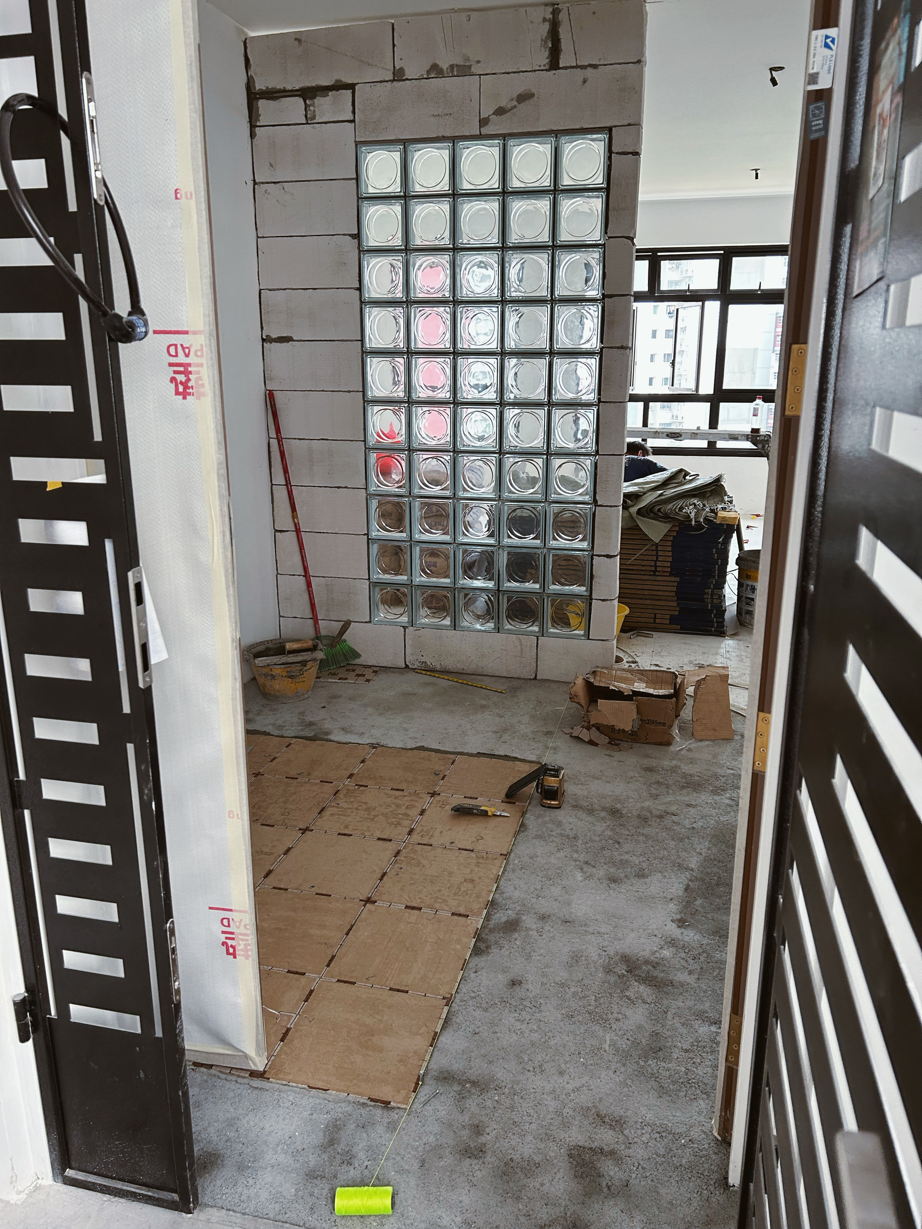 Feng Shui Meets Personal Flair: Our Loafy Haus BTO Adventure! - Glass tile installation, construction site, brick wall