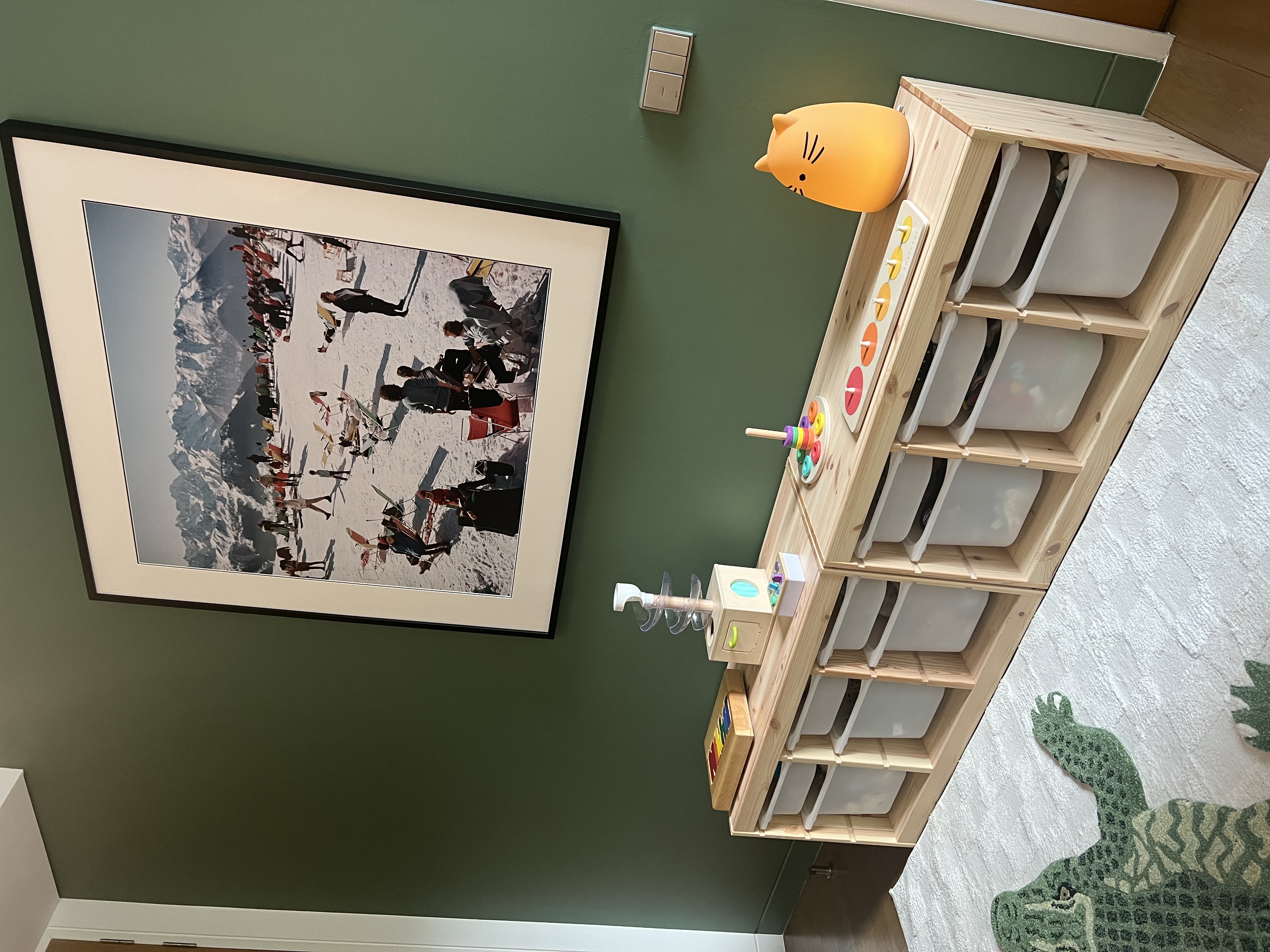 Hello Mr Crocodile! Toddler room at the ready! 🐊 - Mountain landscape photograph on green wall, Wooden storage unit with
