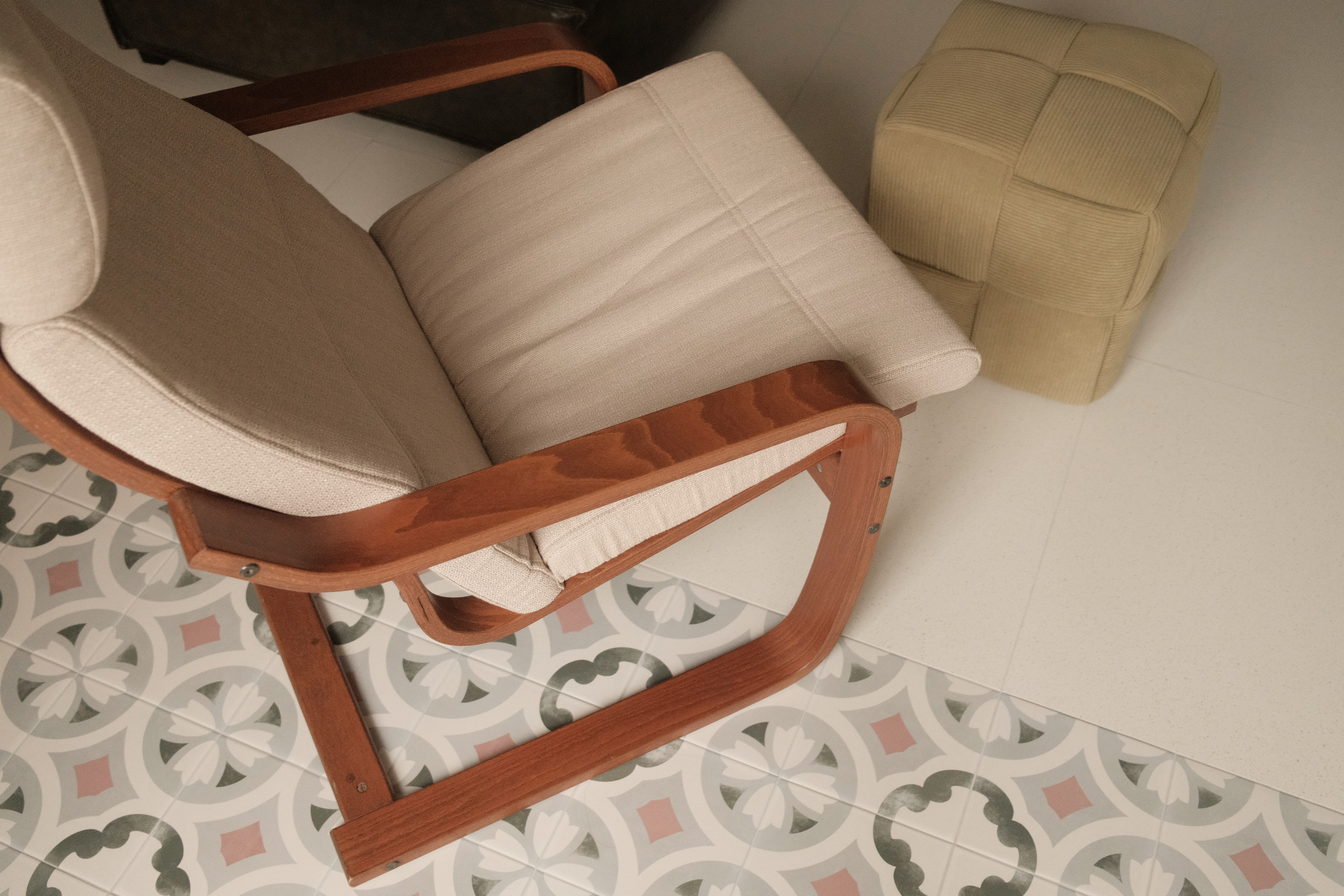 Bringing Timeless Charm into our Mid-Century Modern Living Room - Wooden rocking chair, beige cushion, patterned tile floor