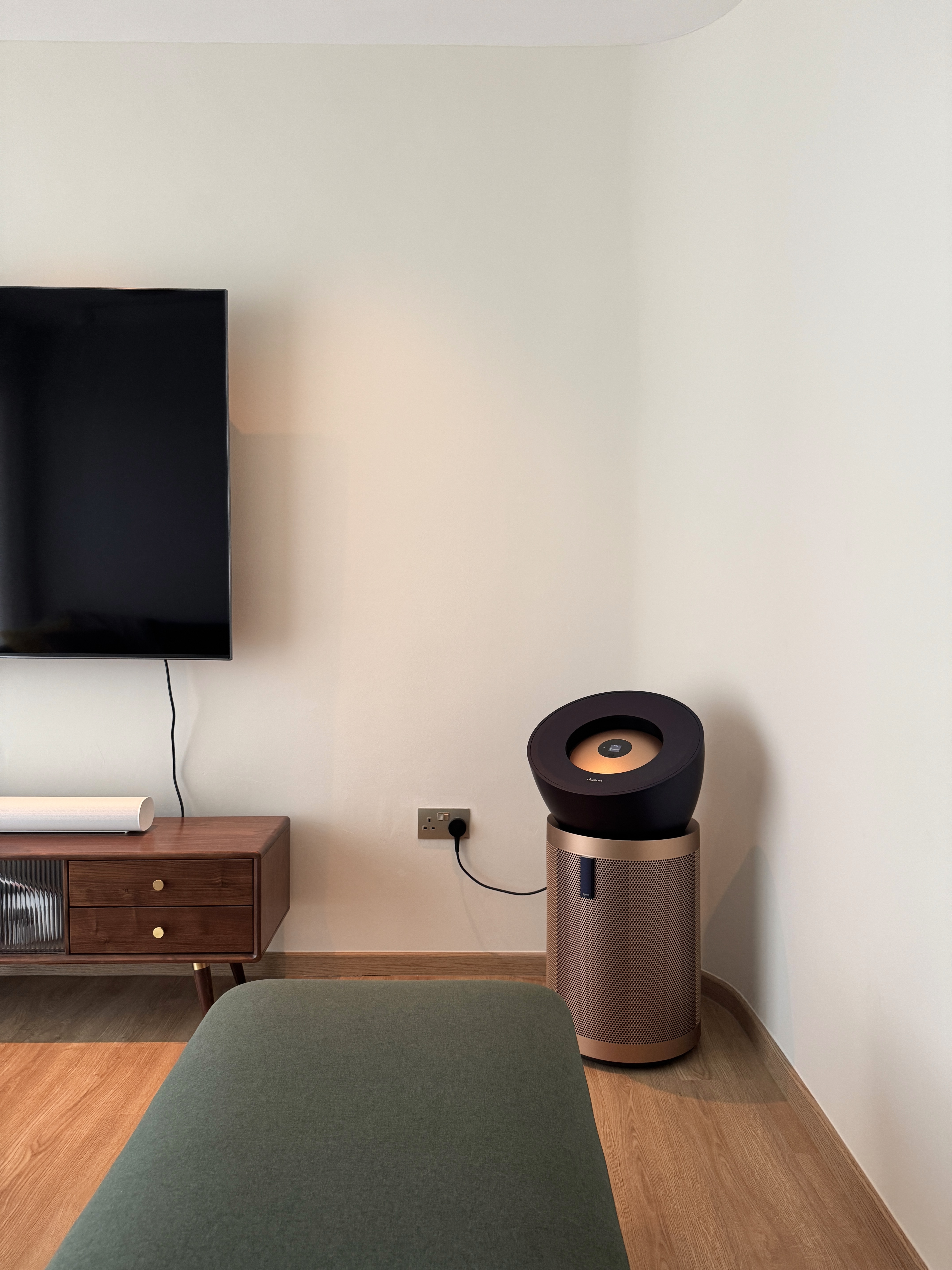 Embracing the Warmth: Our Living Room at Golden Hour  - Modern minimalist living room, sleek entertainment center, wooden TV