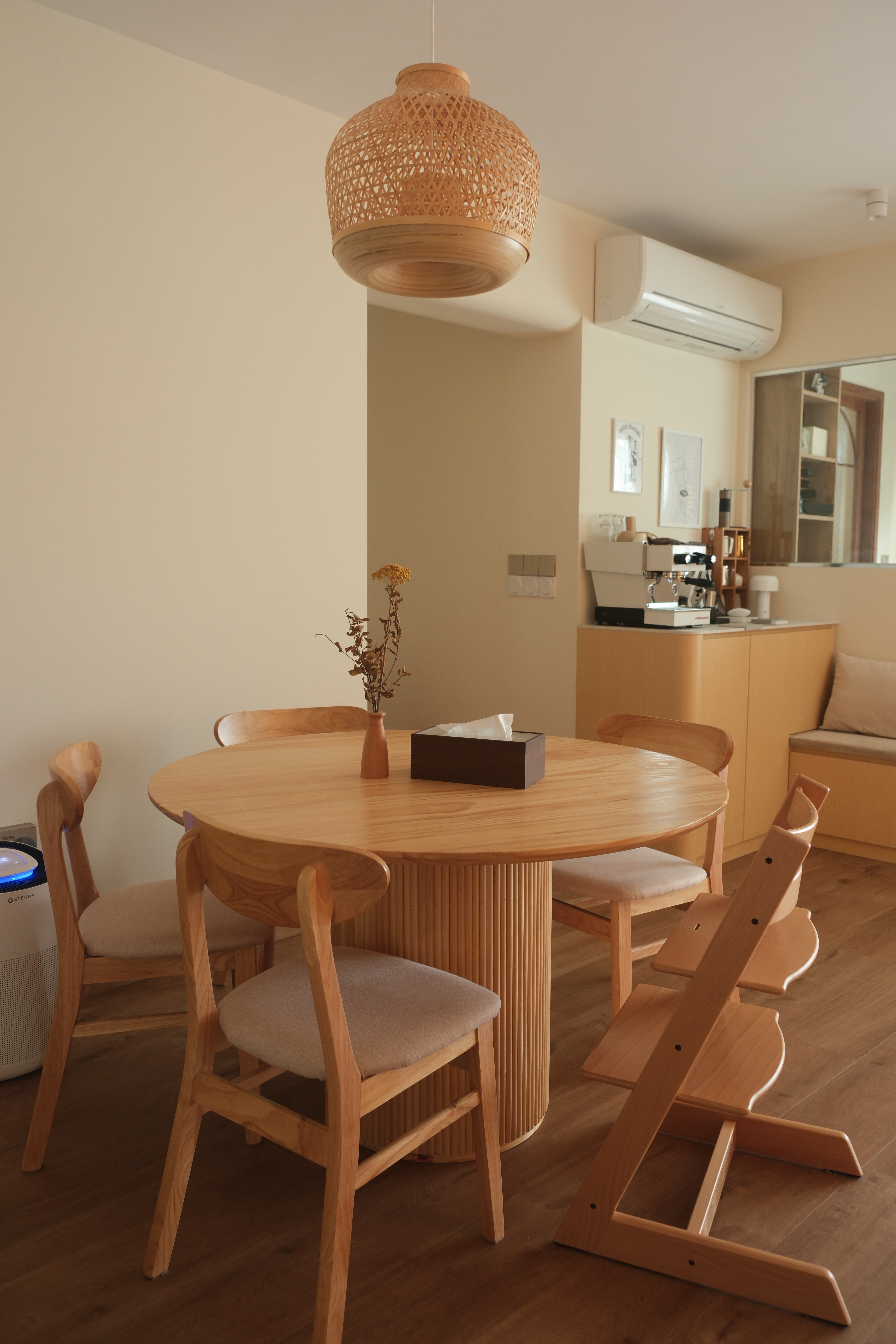 Minimalist Japandi Elegance. Warm tones and natural light.  - Wooden dining table, minimalist design, round shape, light wood