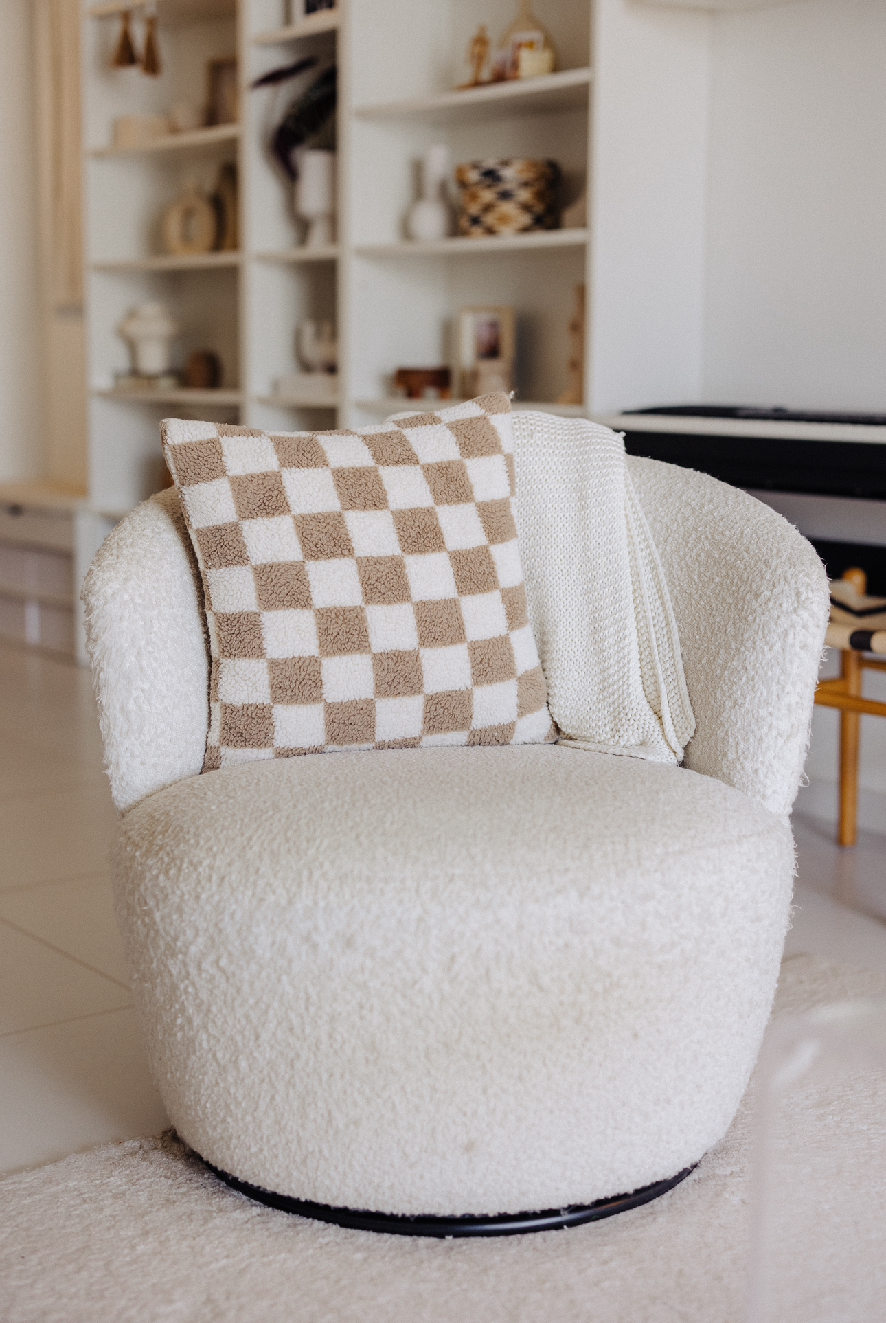 Before & After: Our Living Room During Different Eras Of Our Lives - Cream and brown checkered throw blanket, plush armchair