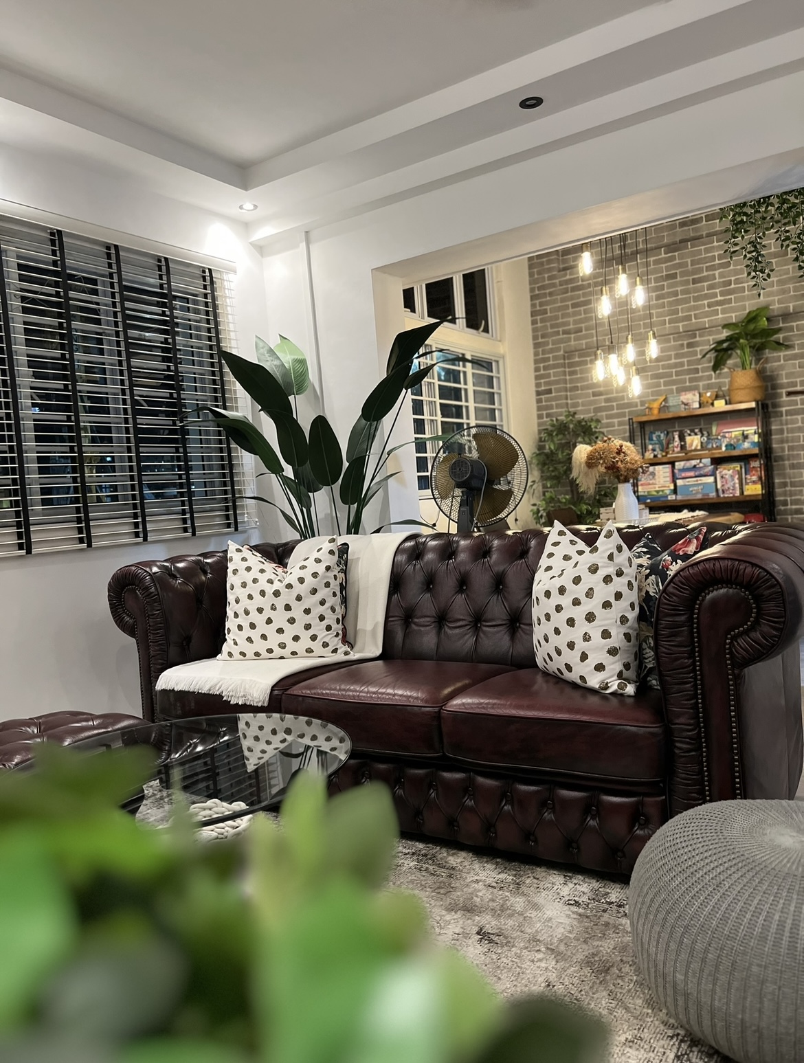 The heart of the home, where conversations flow and memories made. - Leather tufted sofa, modern decor, stylish interior