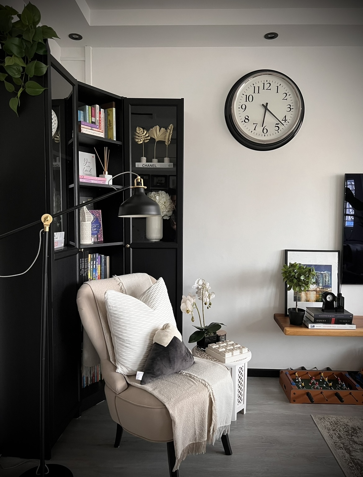 The heart of the home, where conversations flow and memories made. - black leather armchair, beige throw blanket, indoor
